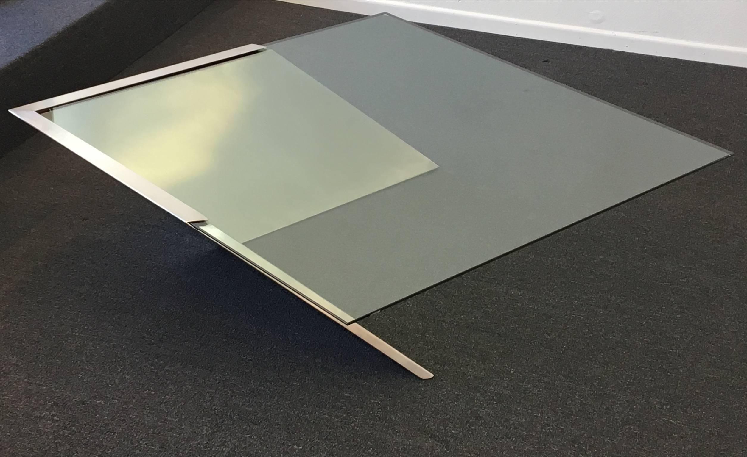 A cantilevered brushed stainless steel base with a 1/2
