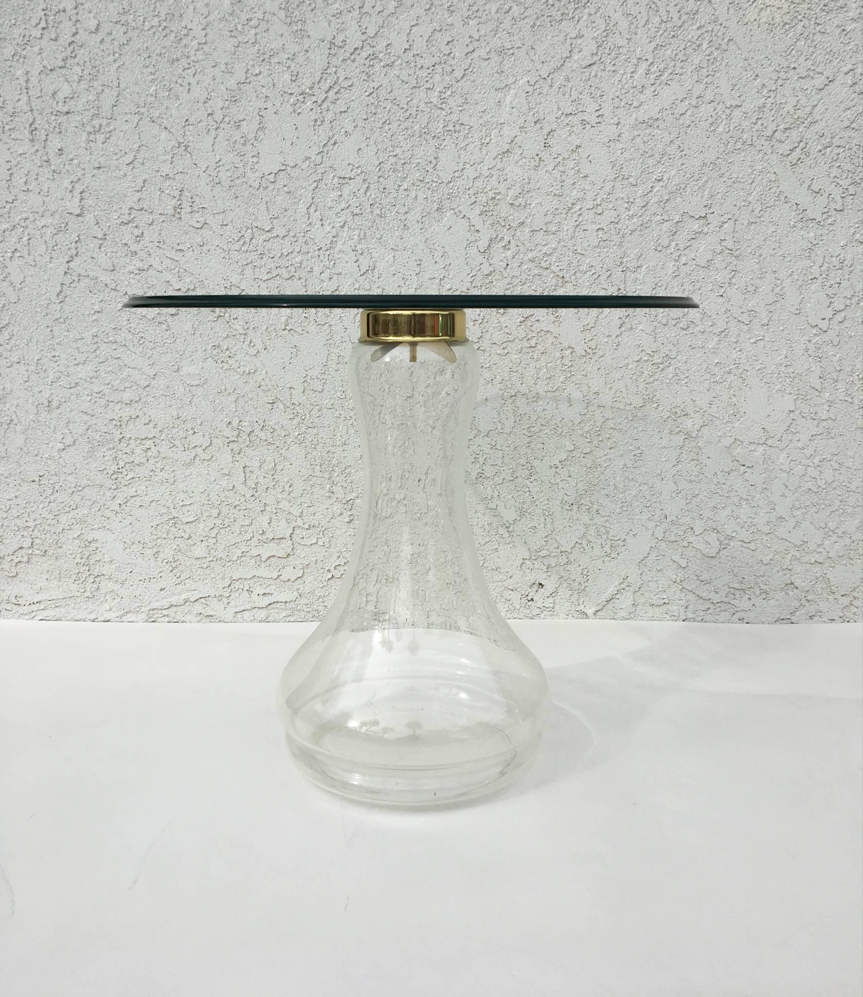 A glass and brass side table by Sarreid Ltd. Spain
The base is handblown and retaining the Sarreid Ltd. label.
The glass top is 1/2
