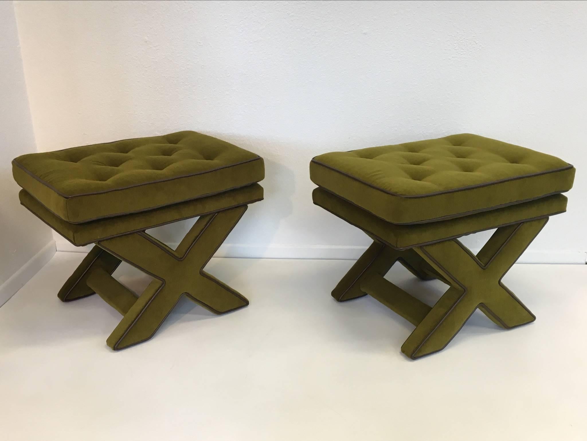 An amazing pair of "X" base benches by Designer Billy Baldwin from the 1970s.
Newly reupholstered in a soft olive green mohair with a dark brown trim.

Dimensions: 20" high, 26" wide, 19.50" deep.
  