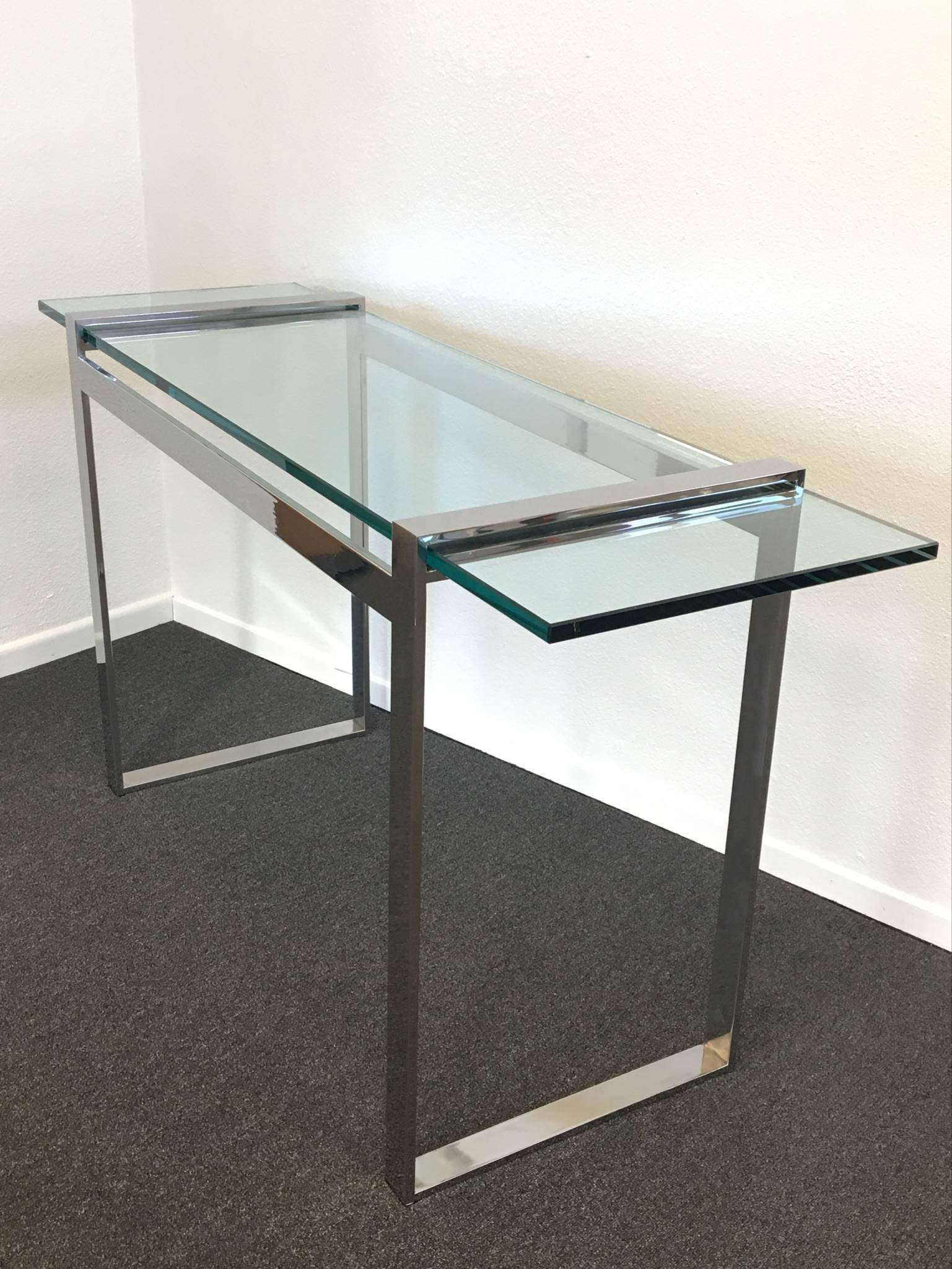 A simple and glamorous nickel and glass console table by Charles Hollis Jones from 
