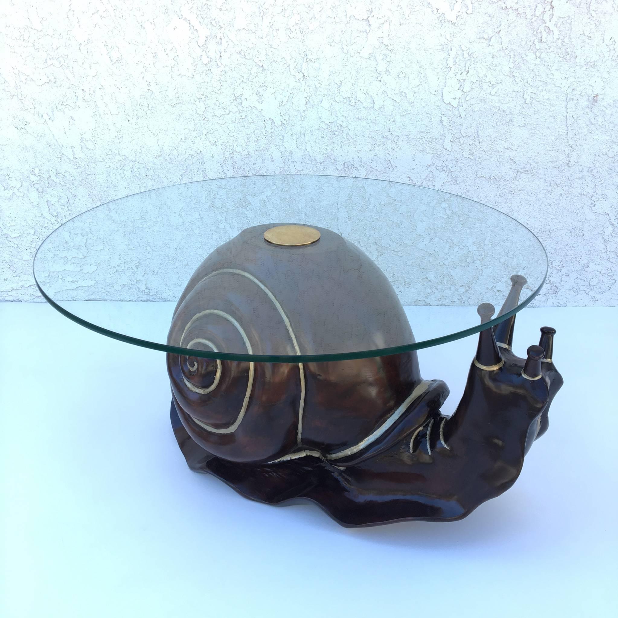 An amazing hand-carved snail cocktail table with a new 1/2