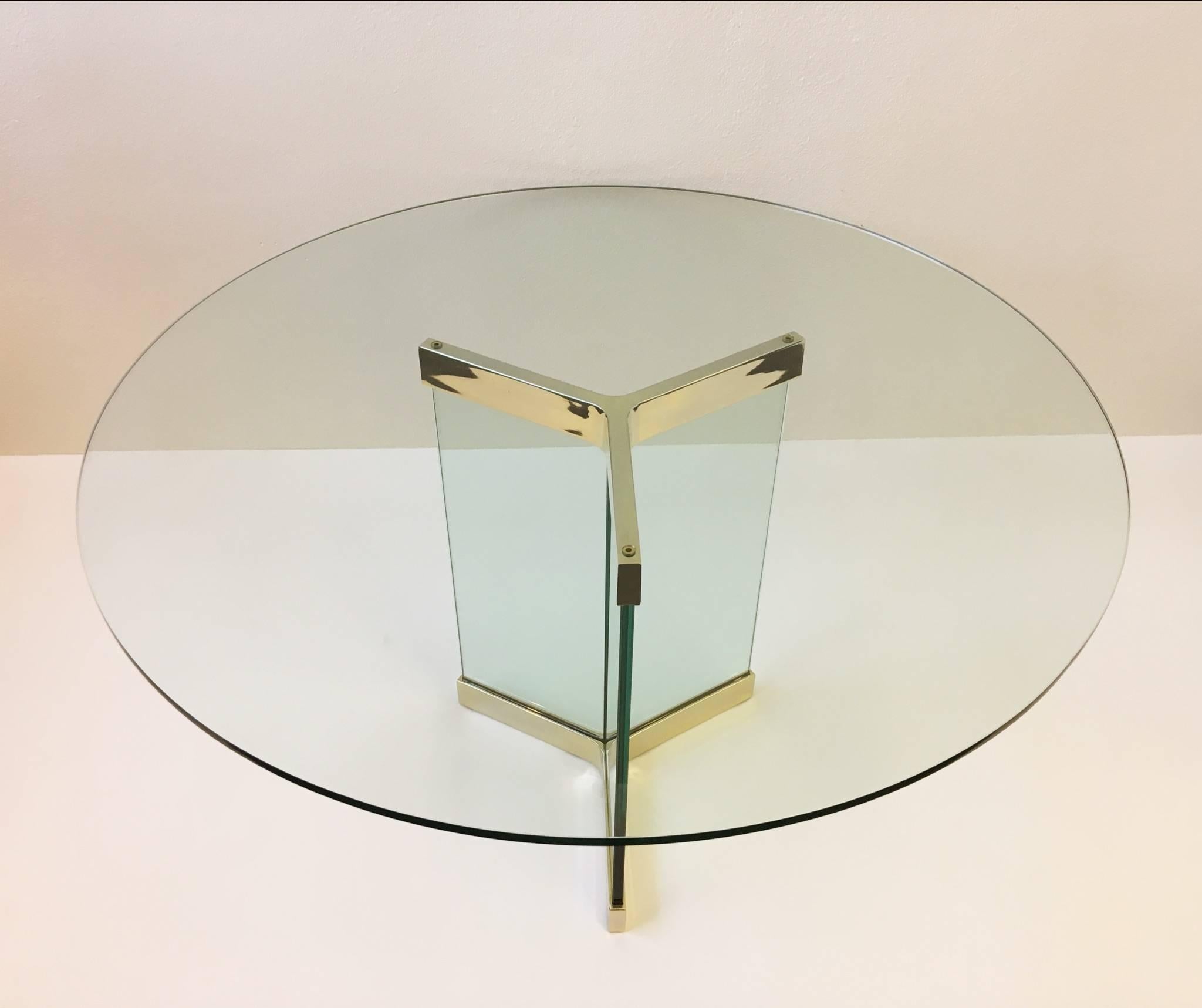 A polished brass and glass round dining table designed in the 1970s by Leon Rosen for Pace Collection.
Measures: New 48