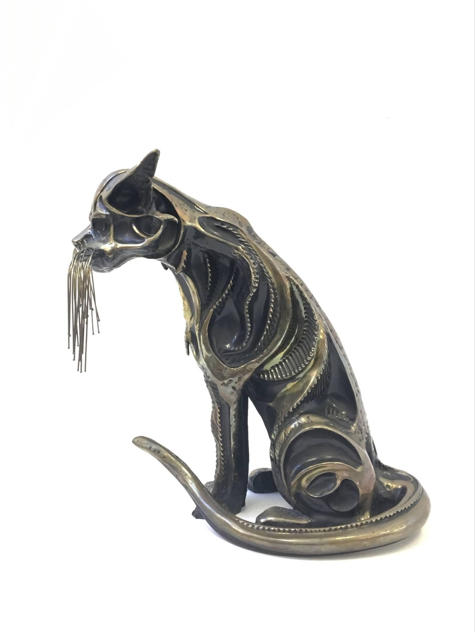 A amazing cast bronze cat sculpture by Internationally known Sculptor John Jagger. Title of the sculpture is 