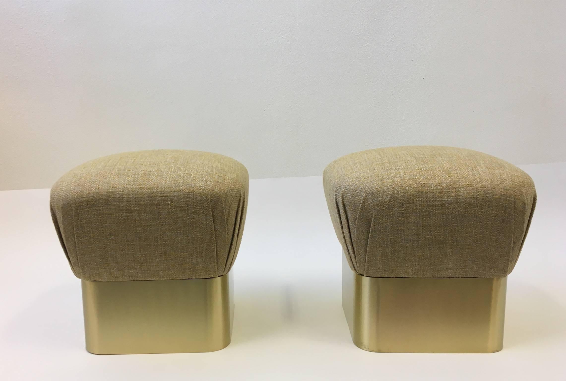 Pair of glamorous poufs designed by Sally Sirkin Lewis for J Robert Scott in the 1980s.
The bottom base is wood with thick satin brass.
Newly reupholstered in a beautiful nubby fabric. Please see detail photos.

Dimension: 18