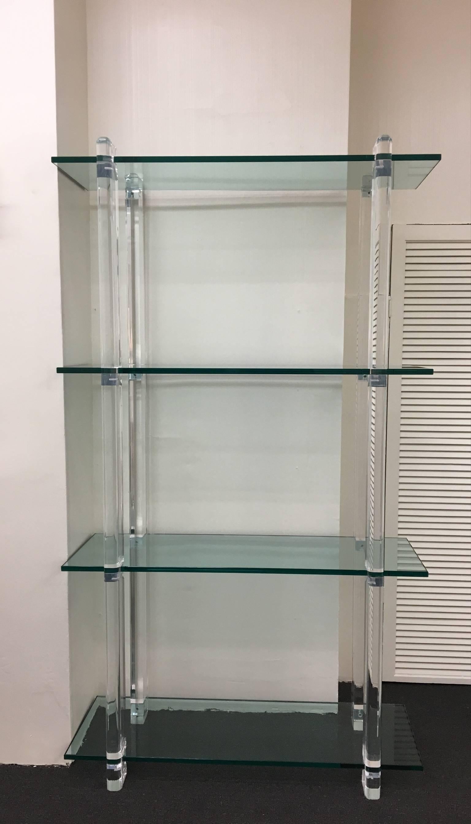 A glamorous acrylic and 3/4" thick glass étagère designed by Carmichaels in the 1980s. The étagère is signed (see detail photos).
The acrylic has been professionally polished, the glass is original. So has some minor wear but no