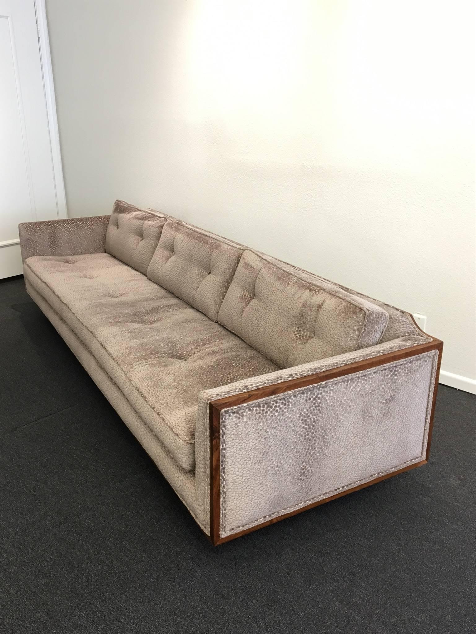 An amazing long, low profile sofa from the 1970s. The sofa has been newly reupholstered in a beautiful moca color soft Chanel fabric. Small nick on one side. Please see detail photos. 

Dimensions: 28