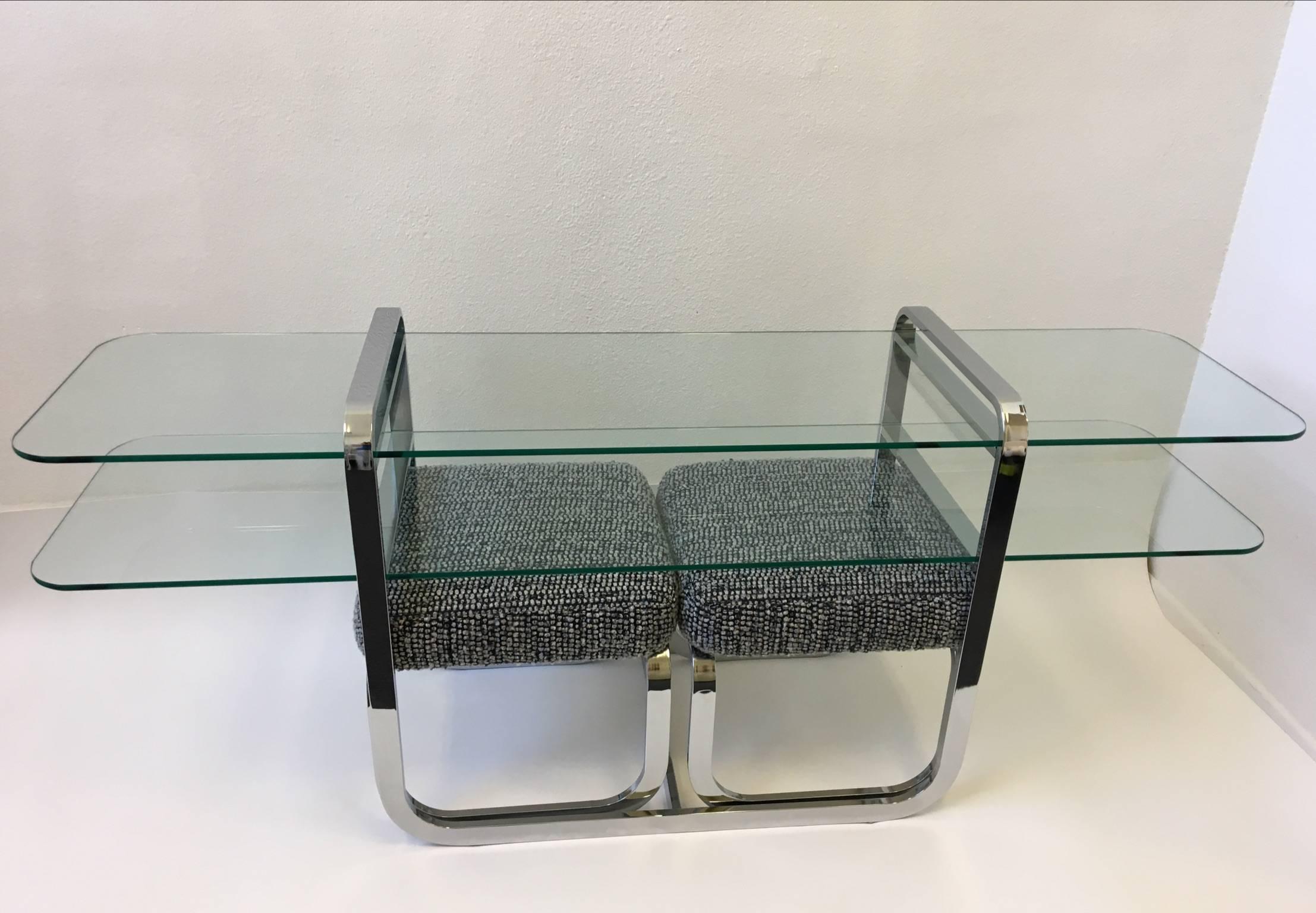 A set of chrome and glass console table with a pair of ottomans. Designed by Design Institute of America in the 1980s 
This usually came together. Newly reupholstered. Please see detail photos. 
Dimensions: Console table- 29