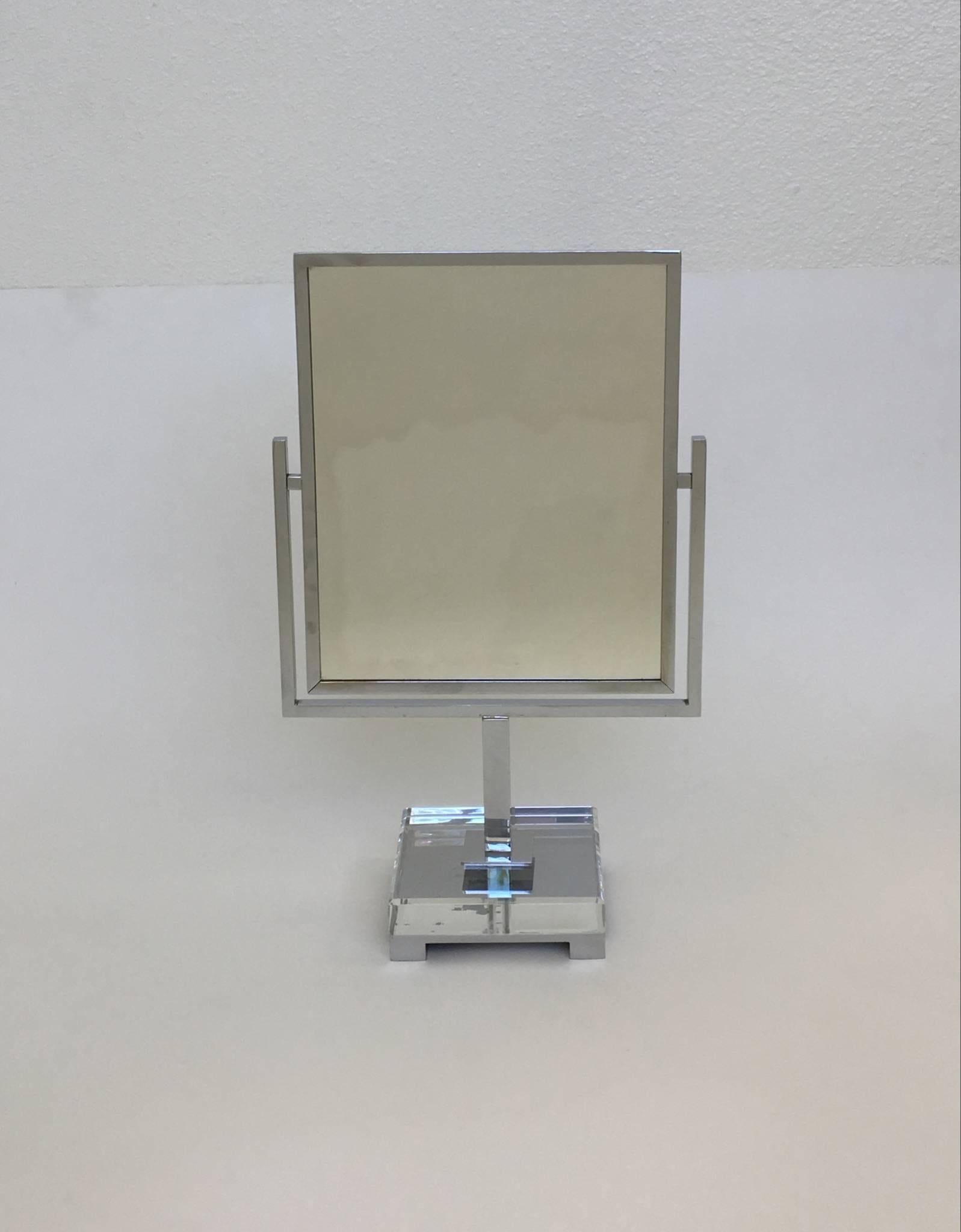 A signed chrome and glass double-sided mirror by Charles Hollis Jones.
The mirror was designed in the 1970s

Dimensions: 19