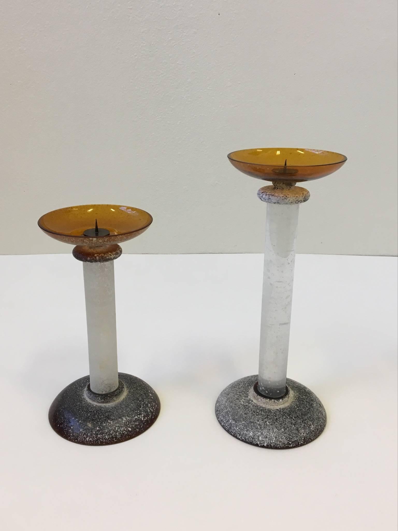 Pair of large-scale Murano glass with a Scavo (textured finish) design by Karl Springer for Seguso in the 1980s.
The small be is signed by Karl Springer (See detail photo)

The the base and candle plate are a amber color and the center is