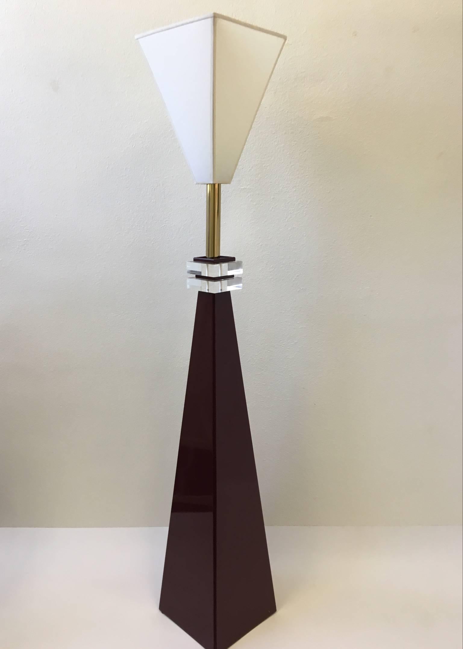 A unusual sculptural burgundy high gloss lacquer and brass with clear acrylic detail. The lamp is in its original condition. Some minor scratch on the bottom of one side (see detail photos) 
Dimensions: 74.5