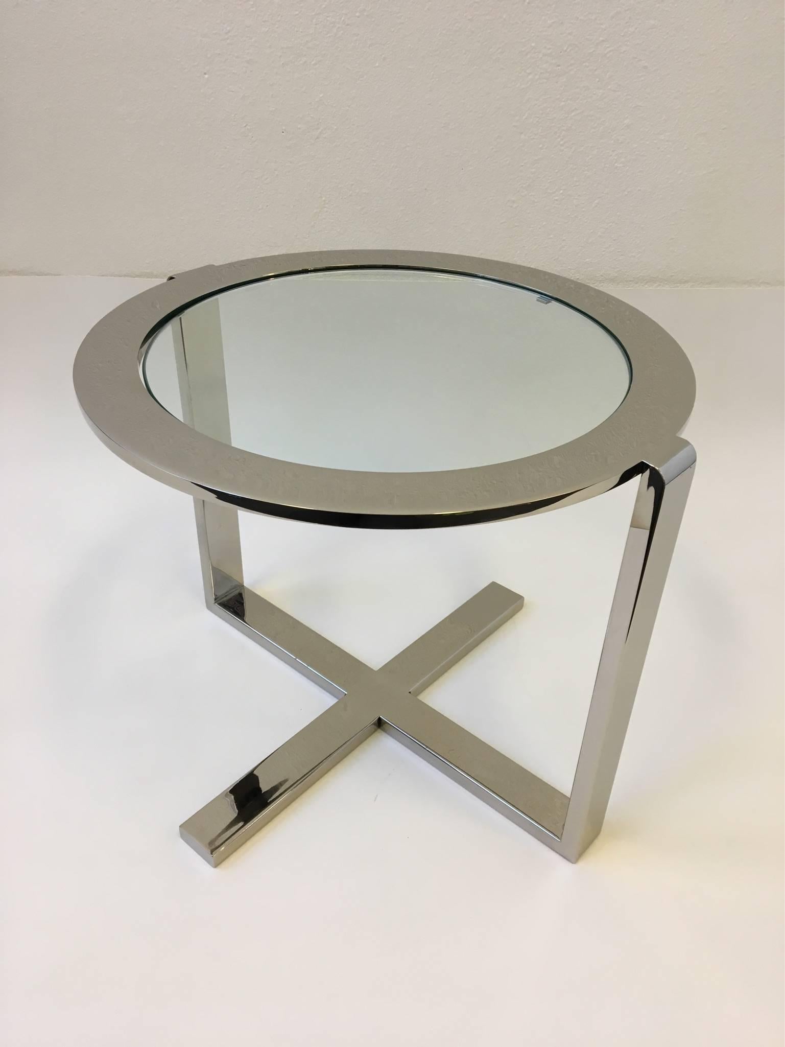 A cool polished nickel and glass side table from 1970s.
The table is well constructed the round top is solid steel. Newly re-plated in a polished nickel finish and new glass.
This came out of a glamorous Steve Chase designed home.
Dimensions: 17