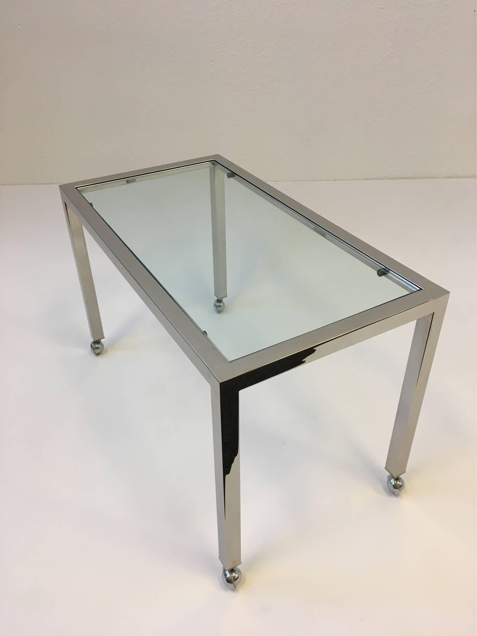 Polished Chrome and Glass on Casters Side Table, style of Milo Baughman