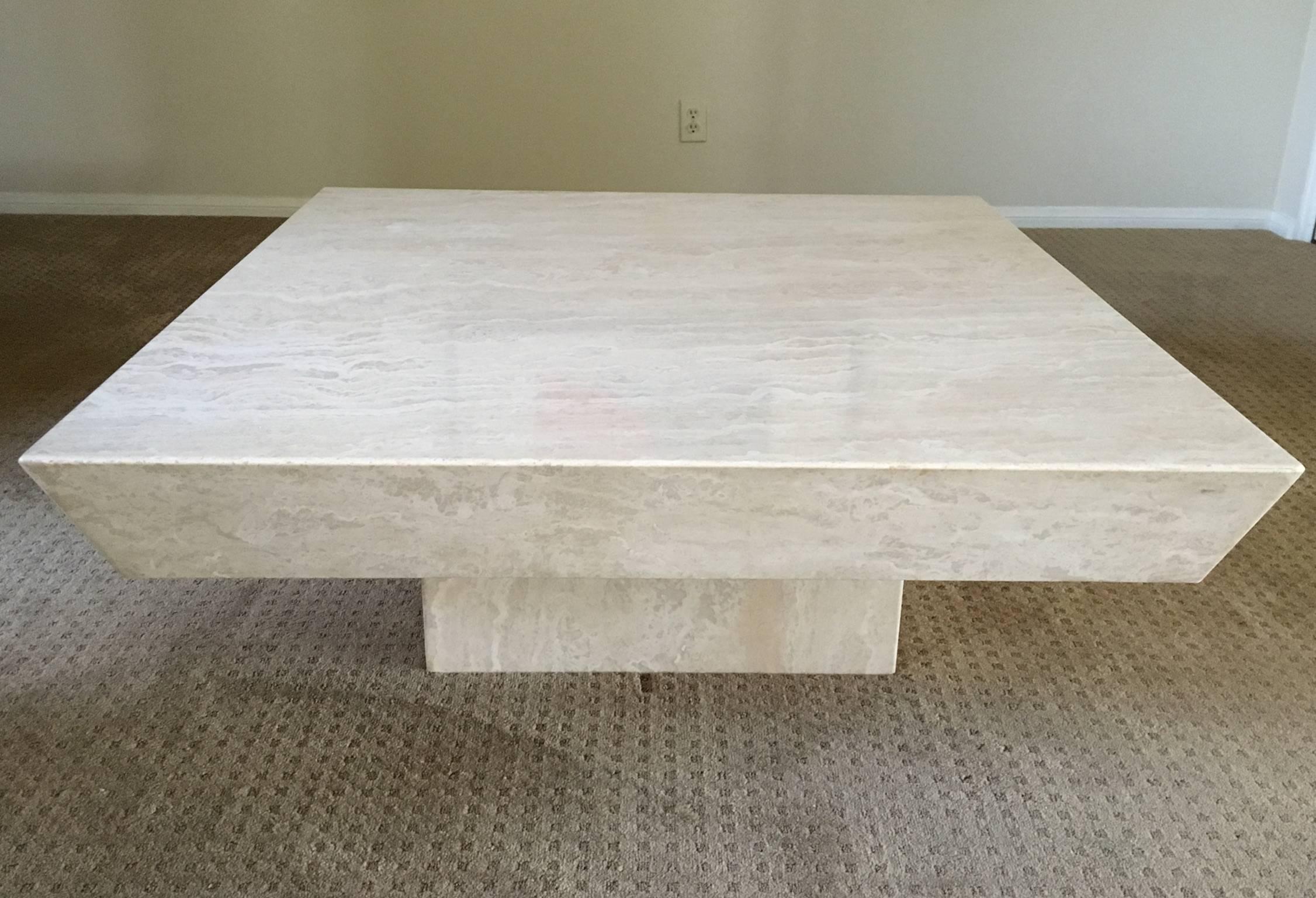 A beautiful polished travertine cocktail table from the 1970s.
Newly professionally polished. The table is in two sections, the top just sits on the base. This can be used indoors or outdoors if it's under a overhead.
Dimension: 16