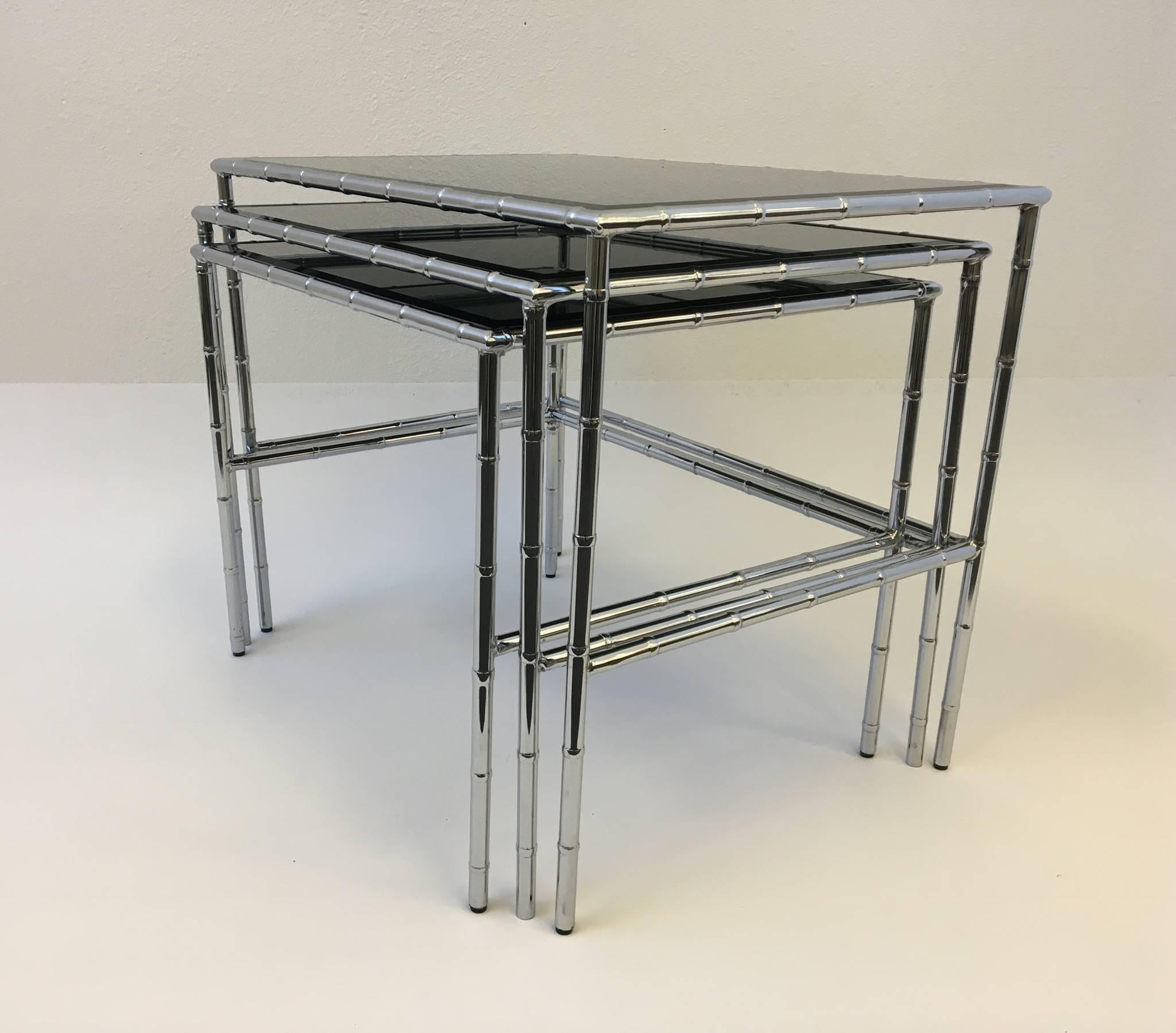 Hollywood Regency Set of Three Chrome and Smoked Glass Faux Bamboo Nesting Tables For Sale