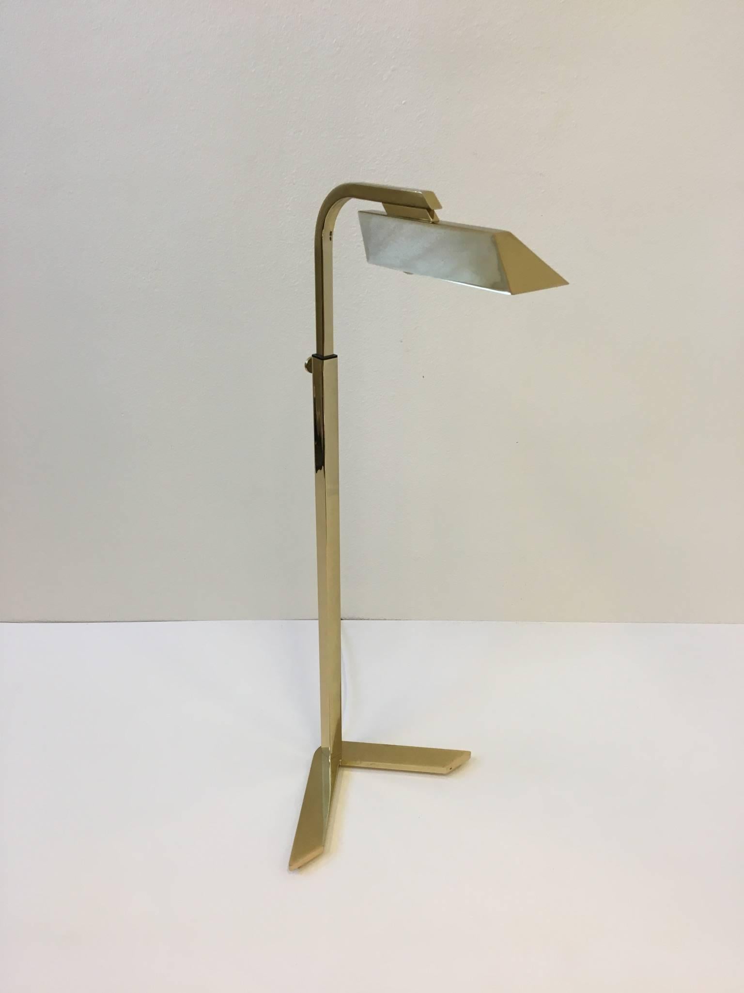 A beautiful polished brass V floor lamp designed by renowned designer Charles Hollis Jones in 1973.
The lamp can be adjusted up and down and has a full range dimmer.
Newly rewired.
Overall Dimensions: 40
