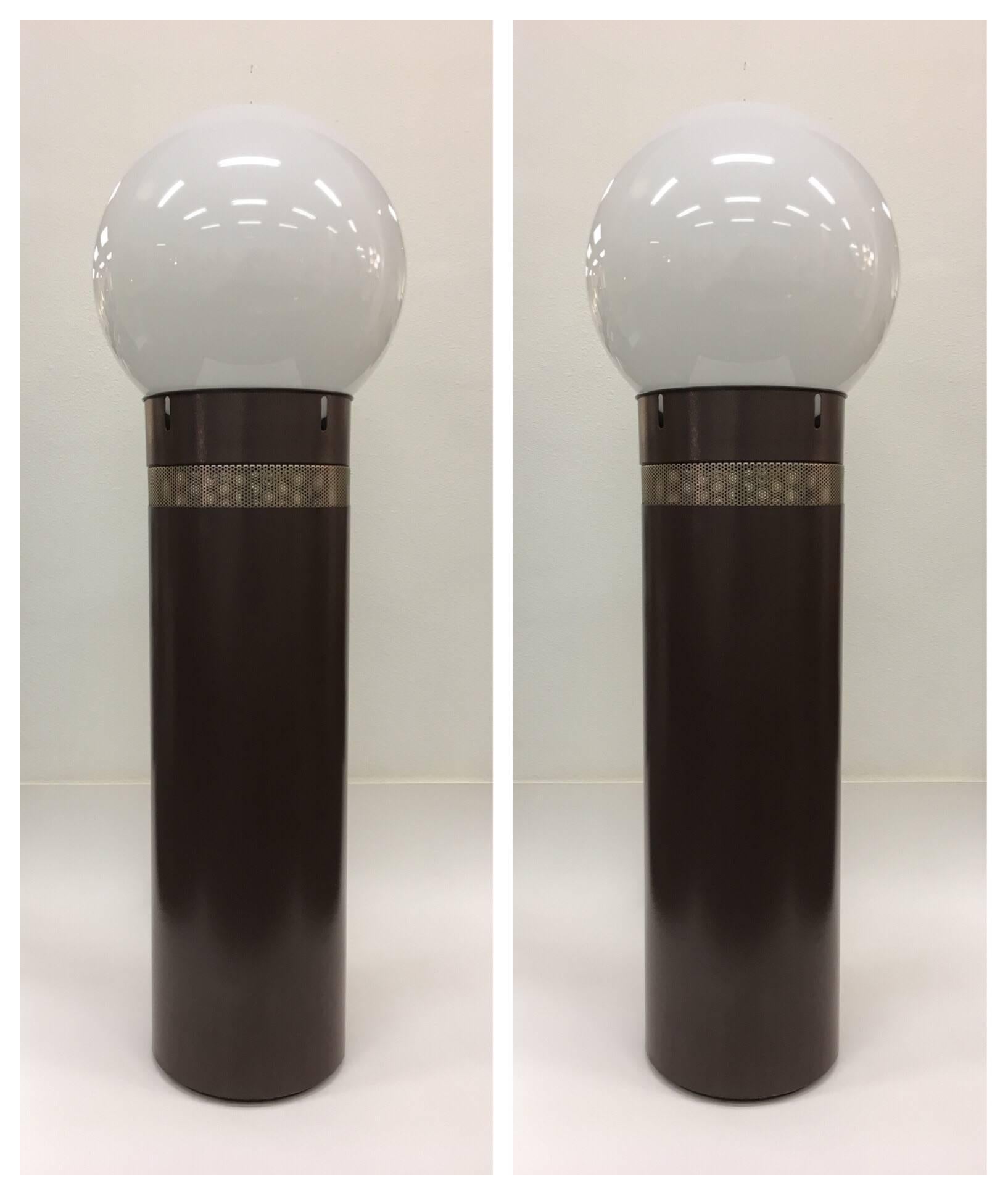 A spectacular pair of chocolate brown and white glass globes 