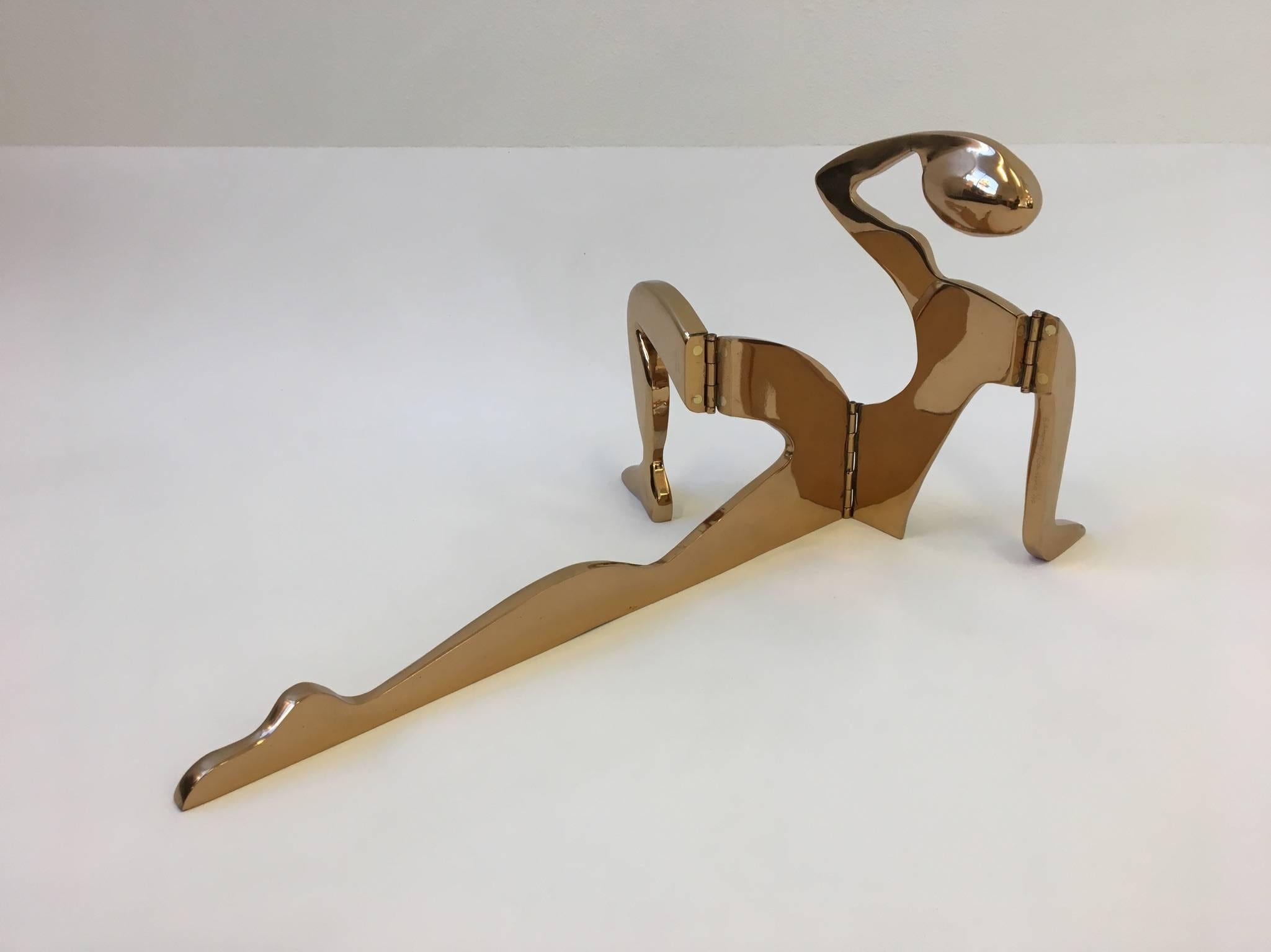 A beautiful large solid bronze reclining figure sculpture by Arleen Eichengreen and Nancy Gensburg from the 1970s. The sculpture is in sections that are connected by hinges. The sculpture is signed and numbered 1/12 twice ones in arm and second in