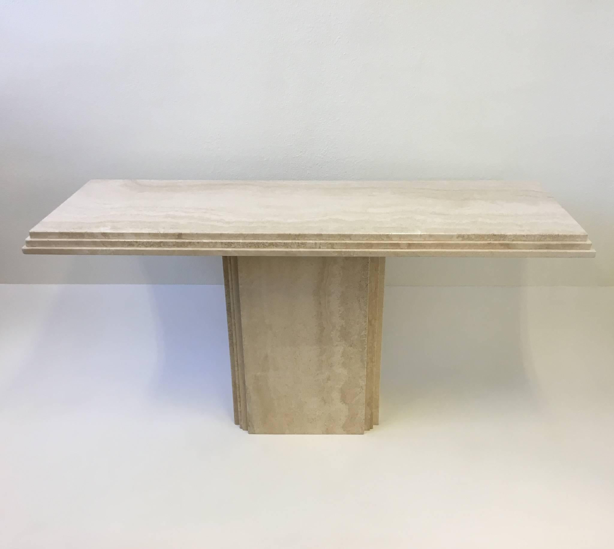 A amazing Italian travertine console table from the 1970s
The table is in two sections. Newly professionally polished.
Dimension: 59.25 inches wide 19.75 inches deep 29.5 inches high.