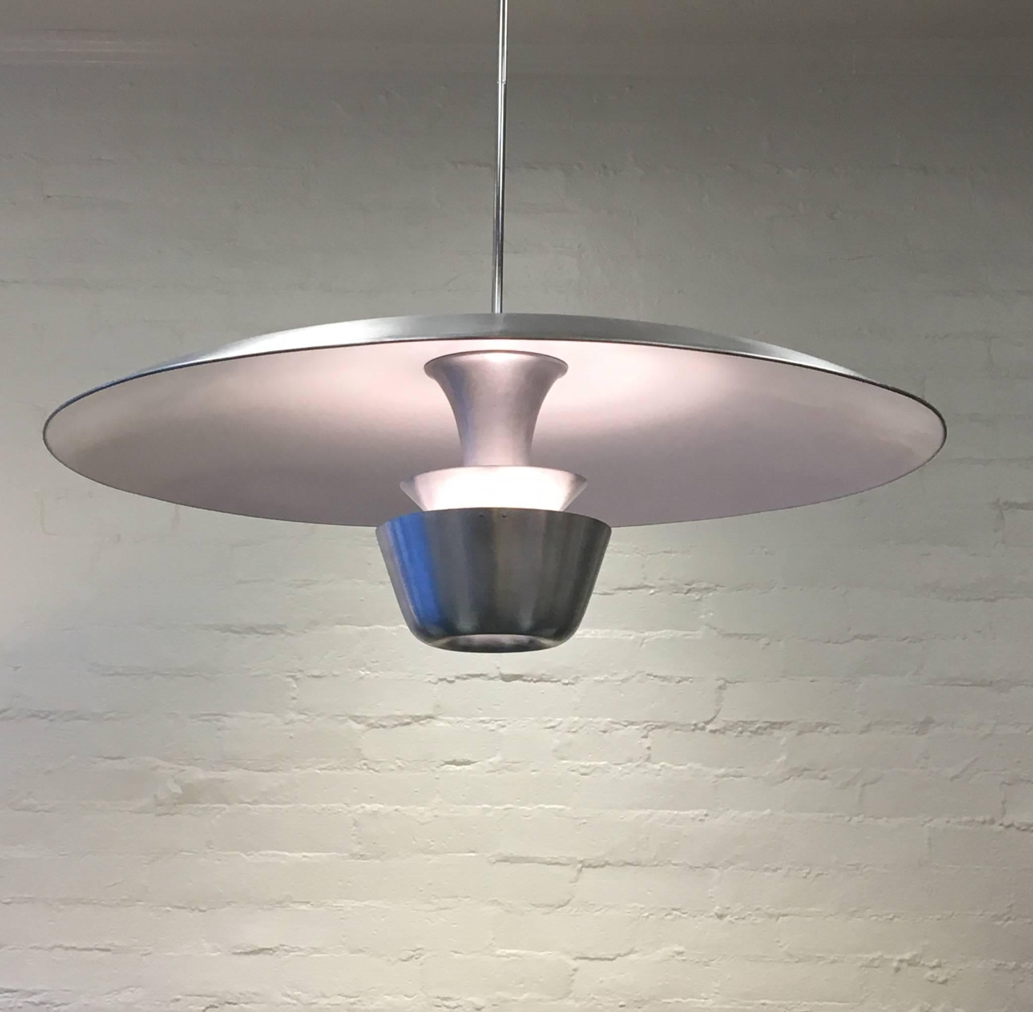 A spectacular large brushed aluminium pendant hanging lamp from the 1950s.
The lamp has been newly restored and rewired. The lamp takes a single 100W regular Edison bulb. The stem is polished Nickel and its 36 inches long we can make it any length