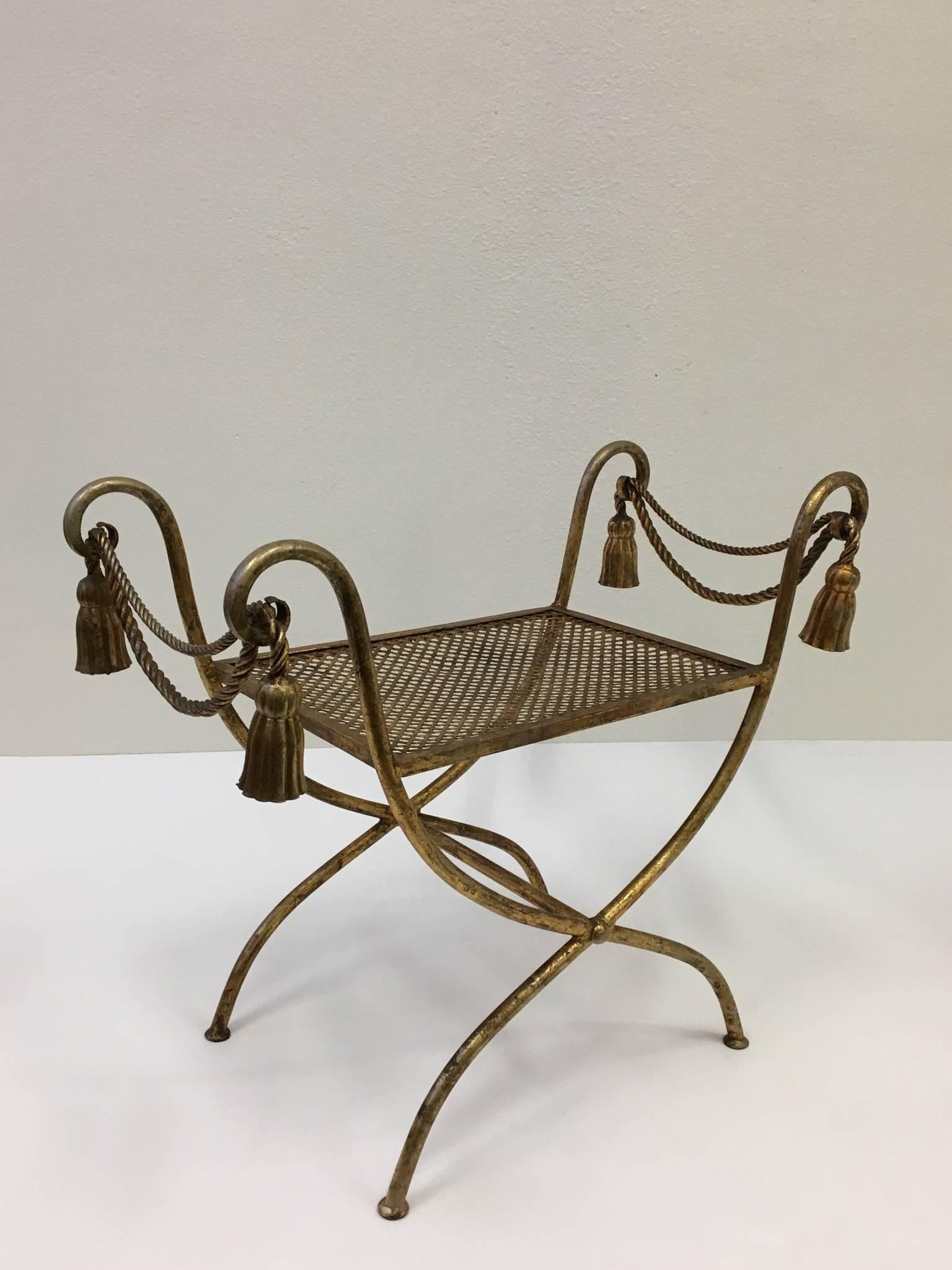 A beautiful Italian gilded iron vanity stool or bench from the 1960s.
The bench is marked Italy on the side (see detail photos).
Dimension: 29.26 inches, wide 16 inches deep, 24.25 inches high.