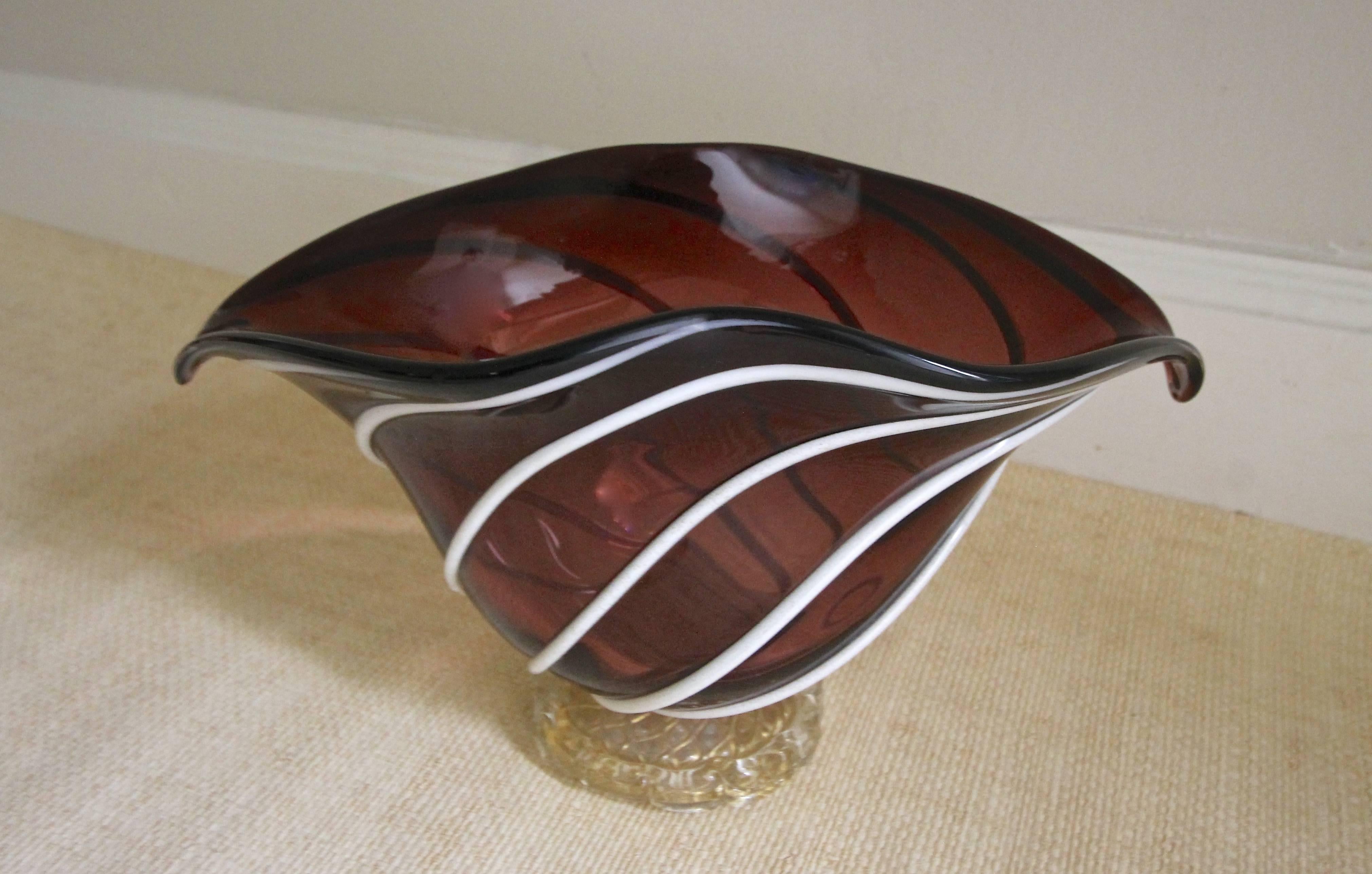 Barovier & Toso Italian handblown glass bowl or centerpiece with clear and gold base and applied lattimo white applied stripes over a rich maroon glass.