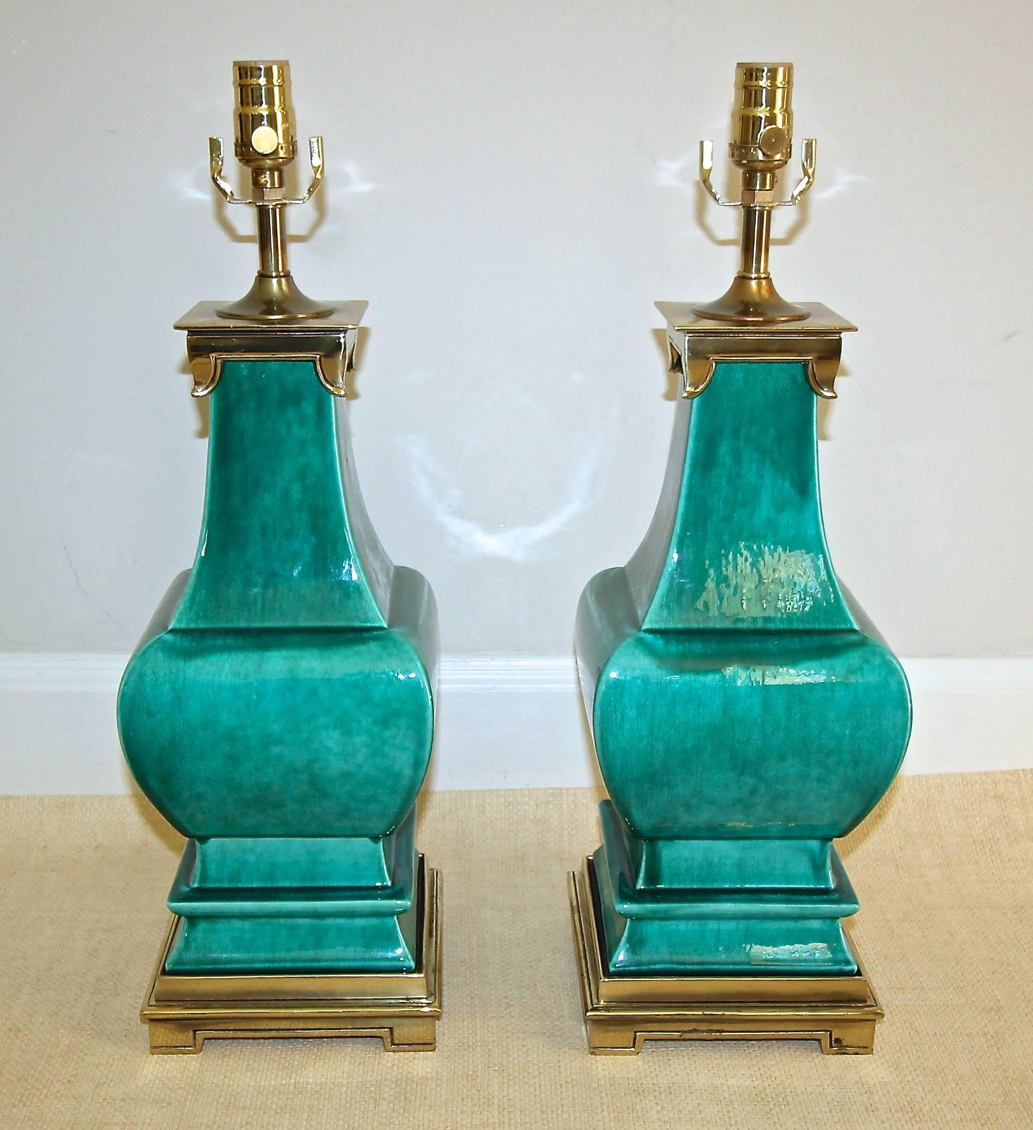 Pair of ceramic lamps by Stiffel in vibrant turquoise crackle glaze and brass finish fittings in the Asian taste. Newly rewired.