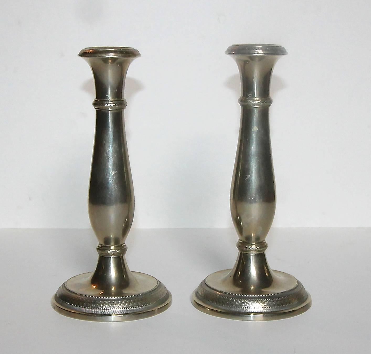 Rare pair of 2nd Empire Austrian candlesticks by Berndorf Metalware Factory (BMF) in nickel silver. Stamped at each base with two-headed eagle (Austrian-Hungarian Empire coat of arms) and BMF. Finely chased. Nickel silver has a more silver color
