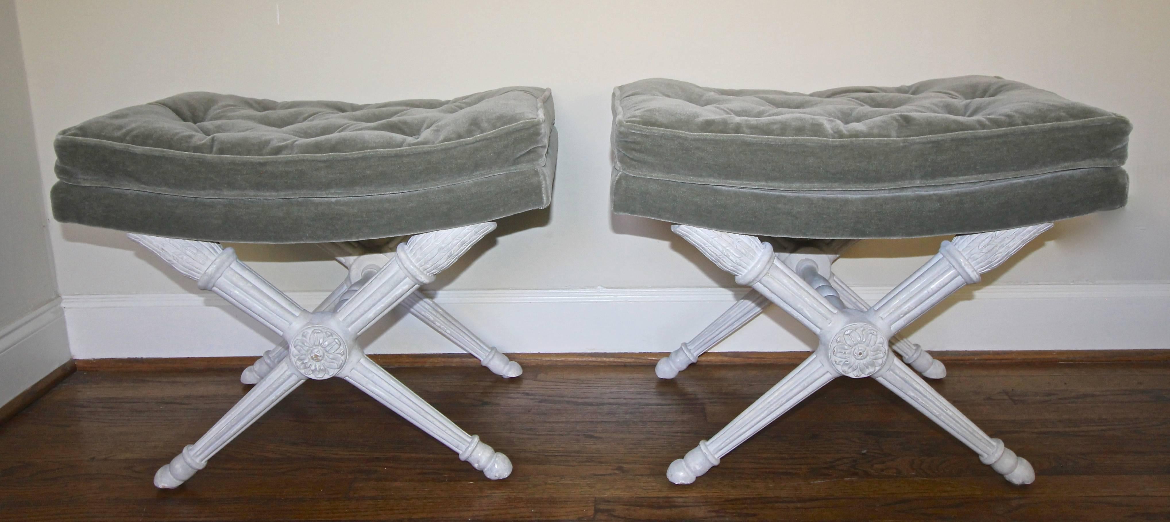 Pair of 1950s French Directoire style carved wood white antiqued finish benches with X-stretcher bases. Newly covered with slate green mohair fabric. The handsome pair fits most decor including modern and traditional.