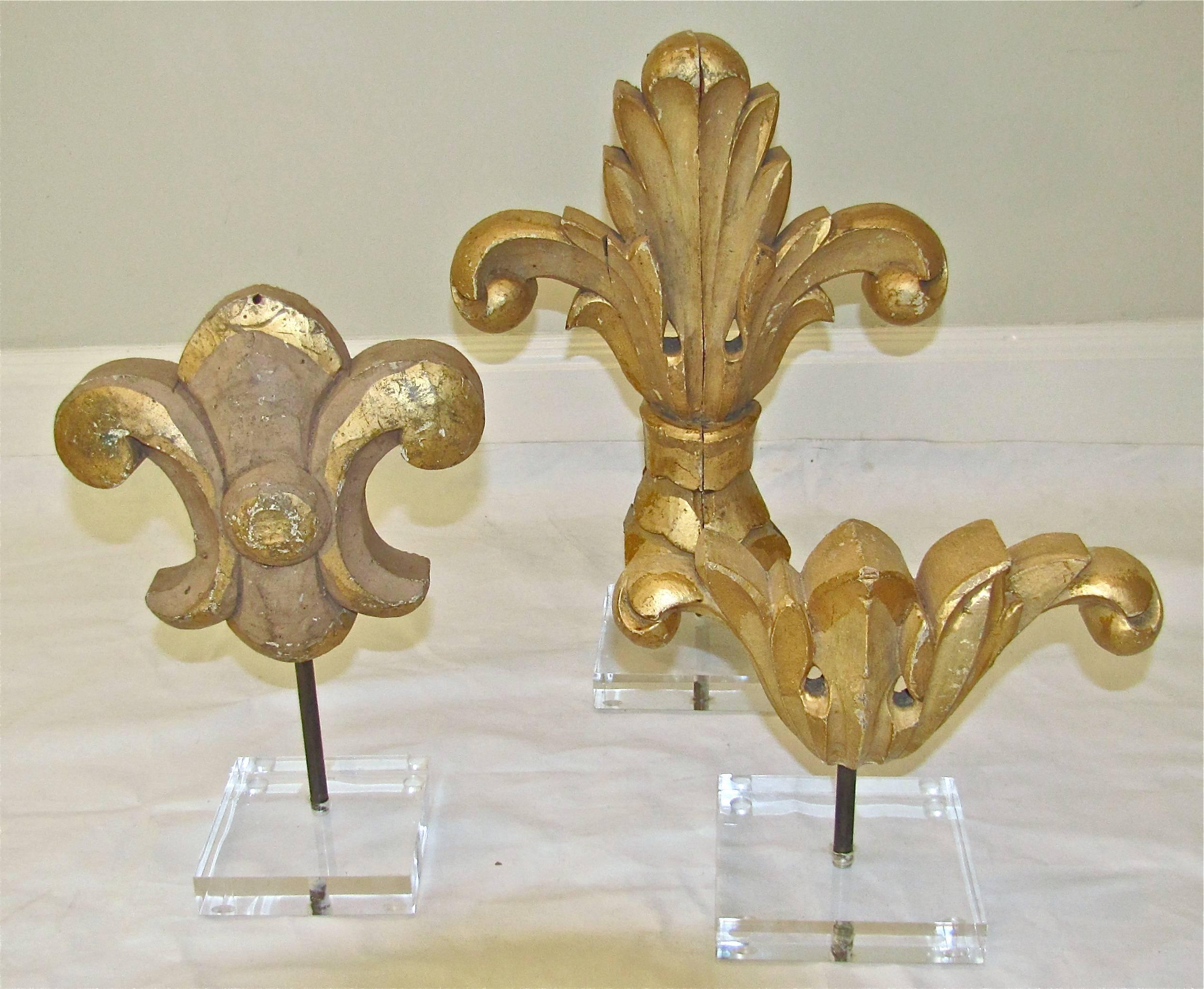 19th century architectural carved wood fragments each mounted on custom acrylic stand. Priced as group. Various sizes:
16