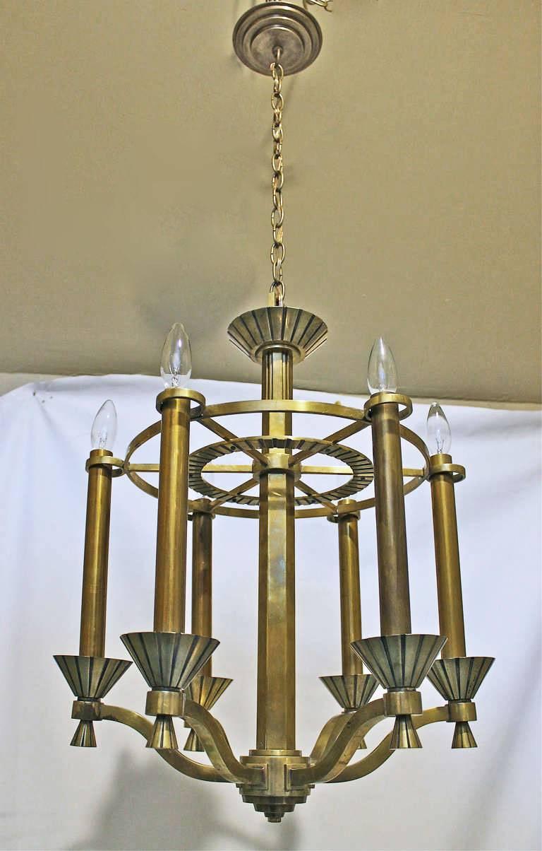 Handsome French Deco brass 6 light chandelier, takes six 40-watt candelabra size bulbs, newly wired. Size without chain: 18.5 diam x 26" tall, overall height with chain 47" can be adjusted as needed.