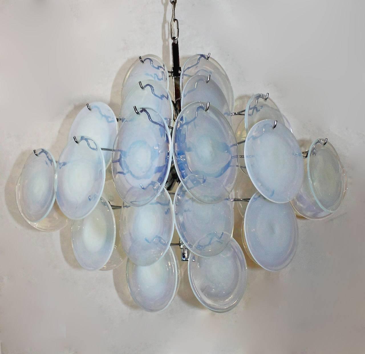 Italian Murano chandelier composed of handblown opalescent glass discs by Gino Vistosi. Chrome-plated metal frame uses 8 - 40 watt max candelabra base bulbs. Rewired. Overall height with chain and ceiling cap 42