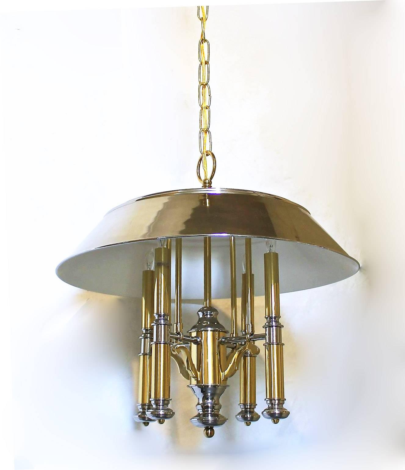 Brass and polished nickel four light modern meets traditional chandelier by Lightolier, new wiring. Uses four 40 watt candelabra size bulbs. Size fixture 19