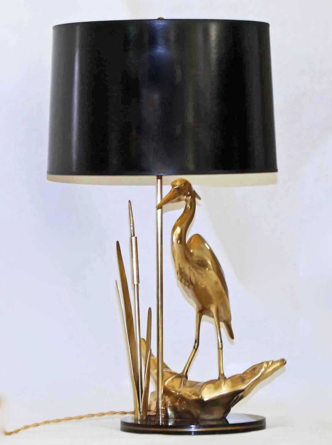 Solid brass heron table lamp resting on black lacquered base. Uses 1 - 60 watt max 