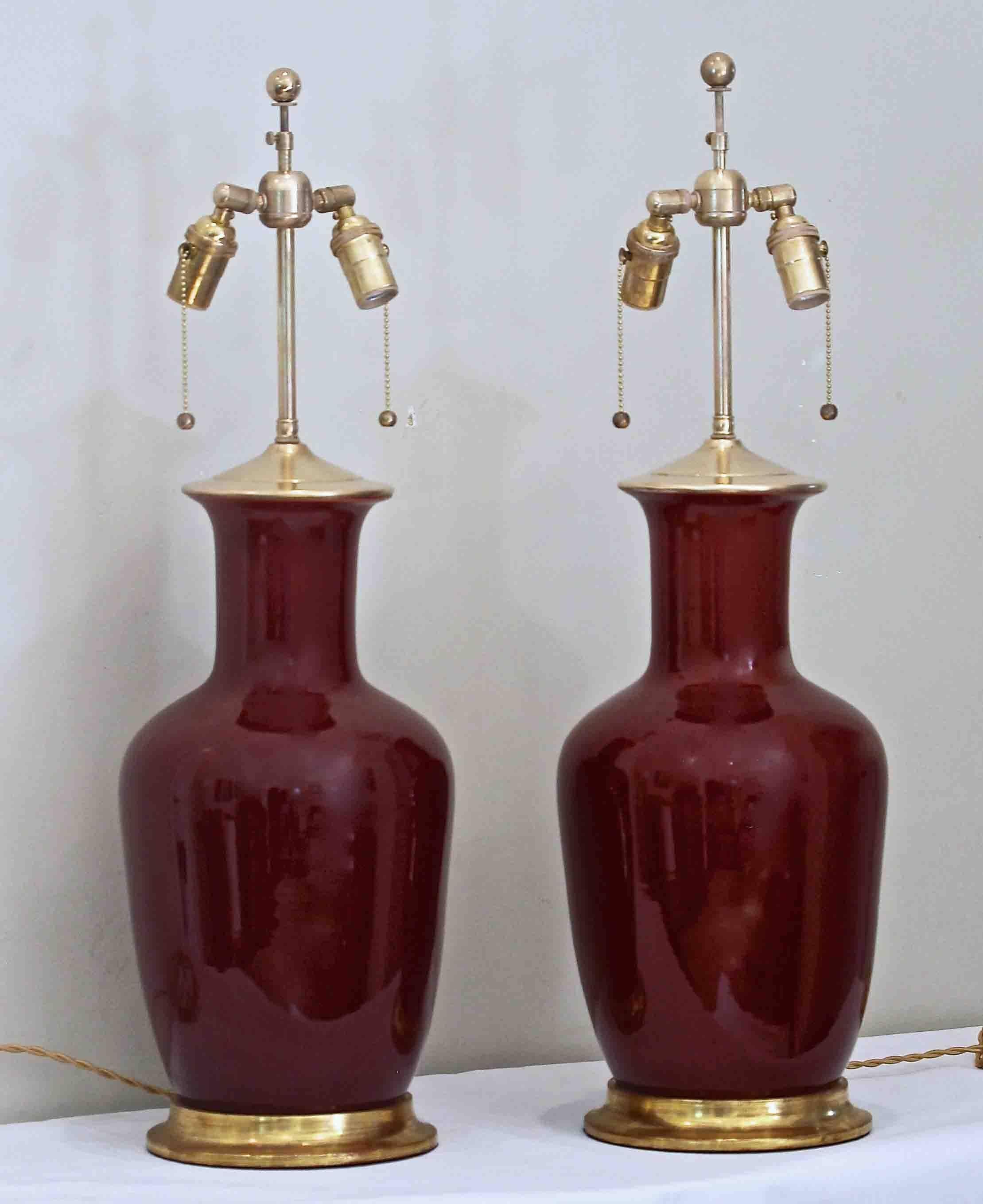 Early pair of oxblood or Sang de Boeuf red table lamps by Christopher Spitzmiller in a Classic 