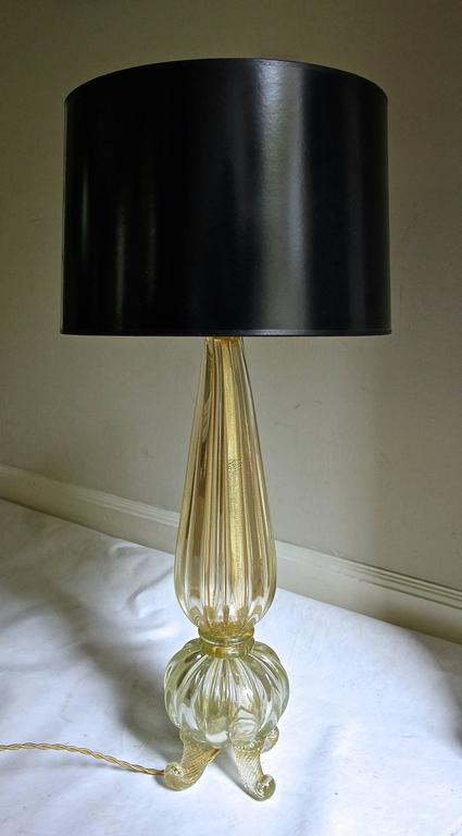 Beautiful handblown Murano footed glass table lamp with gold inclusions, and new brass fittings and wiring. Rewired with French style rayon covered cord and full range dimmer socket. Shade not included and shown for photography purposes only.
Note: