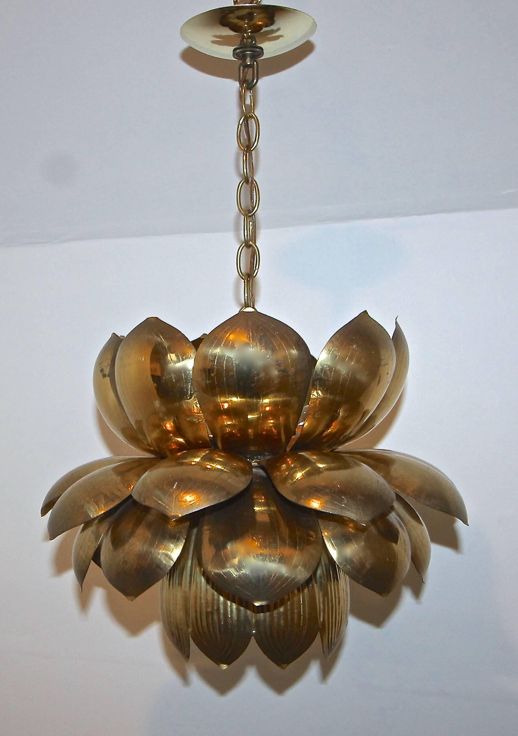 Large brass lotus blossom light pendant or chandelier made by the Feldman Company, Los Angeles. The lower light uses 1 - 60 watt max "A" base bulb and the upper lights use 3 - 40 watt max candelabra base bulbs. The lotus flower is 15"