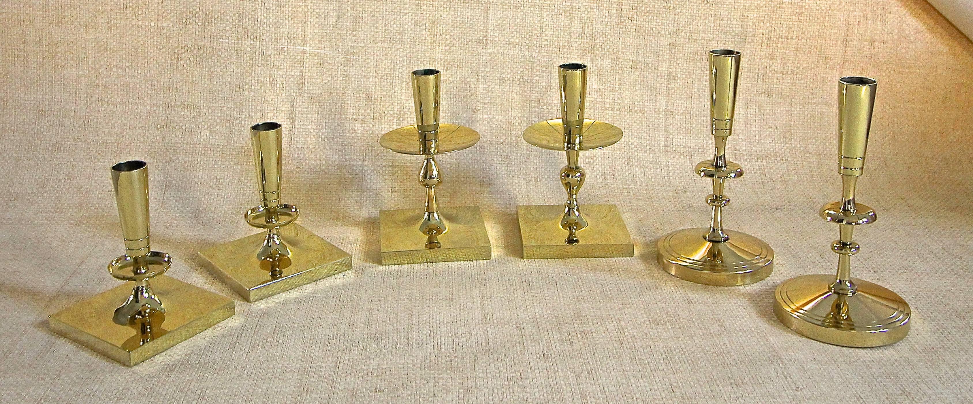 A collection of Tommi Parzinger brass candlesticks by Dorlyn Silversmiths, New York.

top left: 7
