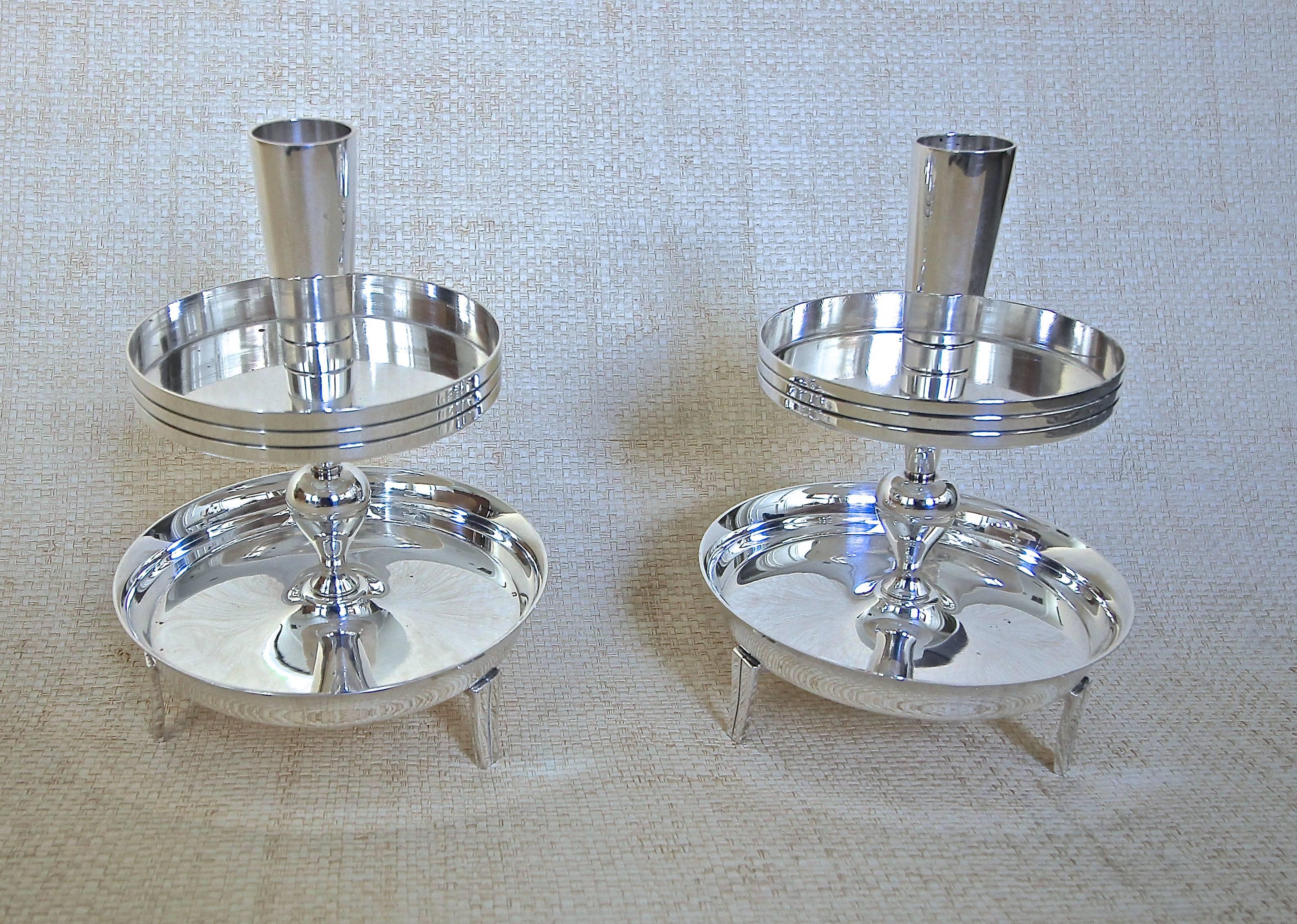 Pair of Tommi Parzinger designed two-tier silver plated brass candlesticks by Oneida Silversmiths. Stamped 