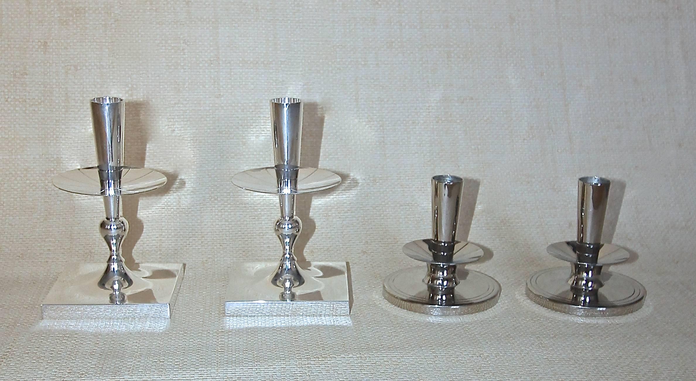 A collection of Tommi Parzinger designed candlesticks. Available for purchase separately.

Left pair: 7" tall x 4" wide in Silver-plated brass marked "Made by Dorlyn Silversmiths PR"  $650
Right pair: 4" tall x 4"
