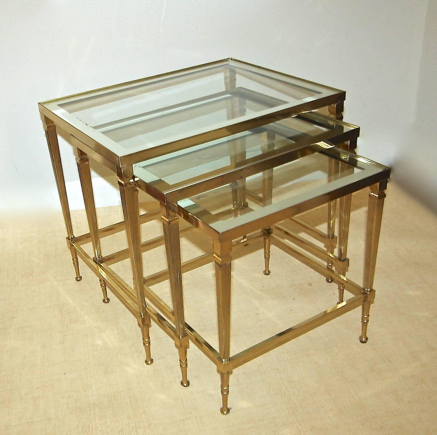 Trio of Maison Jansen brass nesting tables with mirrored edge glass tops.
Size of each table:
20.25" L X 15.25" W X 18.25" H.
17.25" L X 14.25" W X 17" H.
14.5" L X 13" W X 15.5" H.
