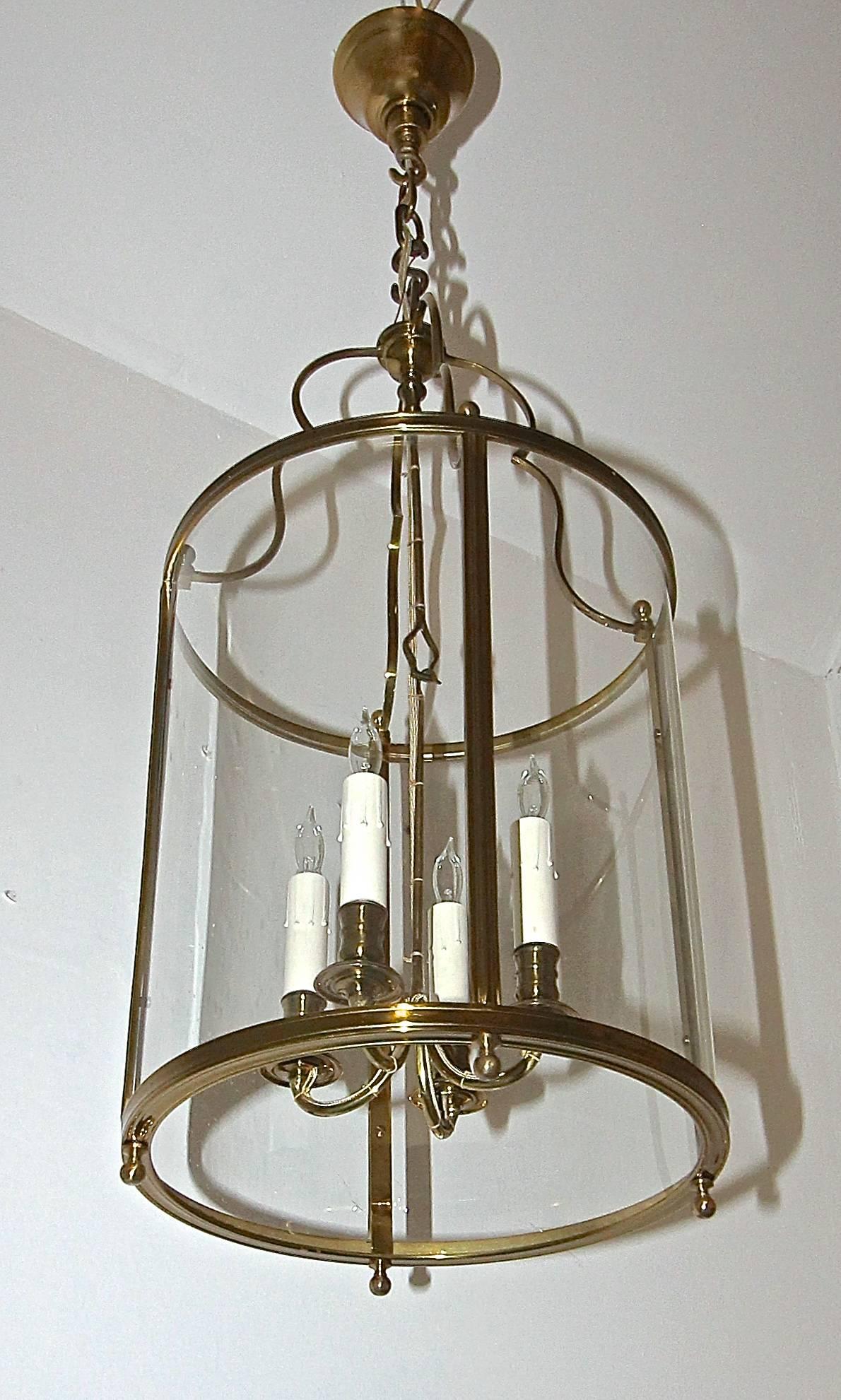 Exquisite and delicate bronze four-light ceiling hall or entry lantern by Maison Baguès, Paris. Four delicate candle arms and four curved glass panels. French style attached wiring to arms. Fixture uses four 40 watt max candelabra base bulbs, newly