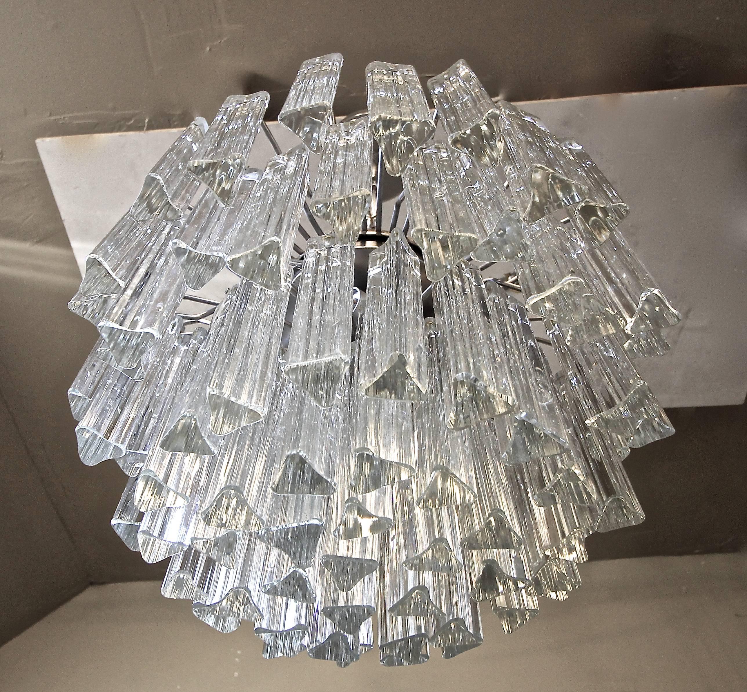 Venini multi-tier triedri crystal prism four-light chandelier with steel frame. Fixture uses four 40 watt max candelabra base bulbs. Newly wired. Overall height with chain and canopy is 30" can be adjusted as needed.