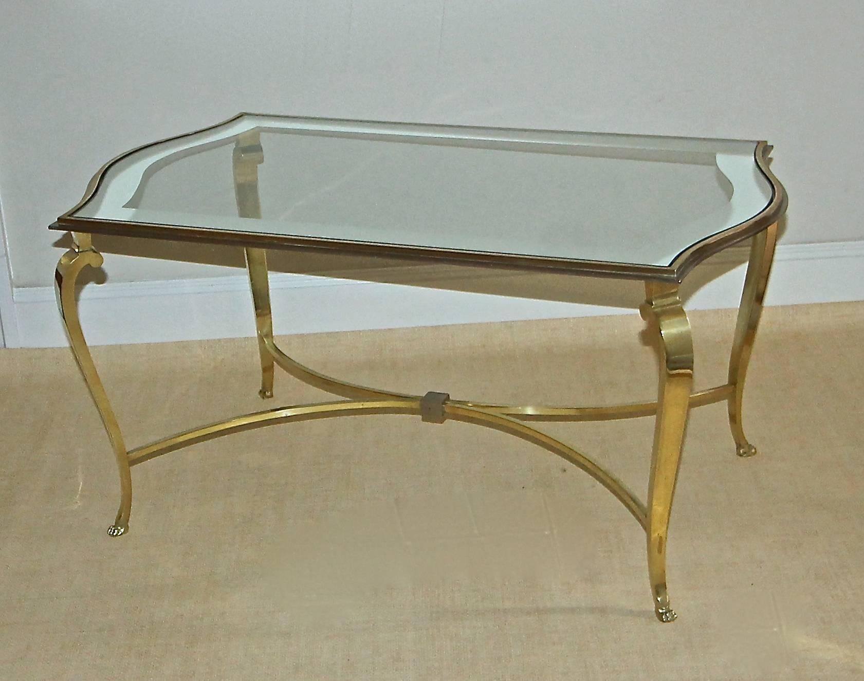 Hard to find bronze and nickel French coffee or cocktail table with glass mirrored edge inset top by Maision Ramsay. Exceptional quality and detailing including elegant bronze cabriolet legs resting on pawed feet. Table top is beautifully curved at