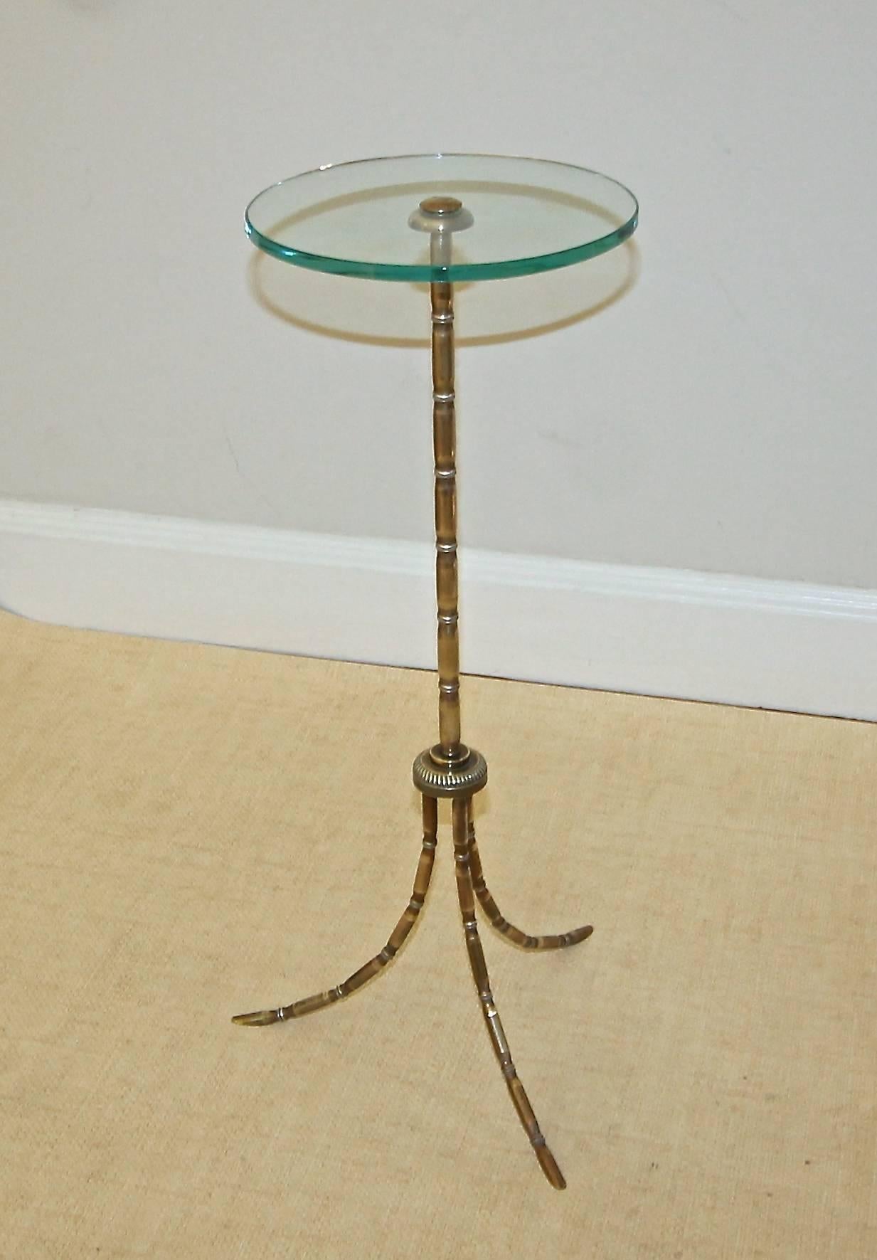 French Bagues finely detailed bronze faux bamboo side table with round glass top.