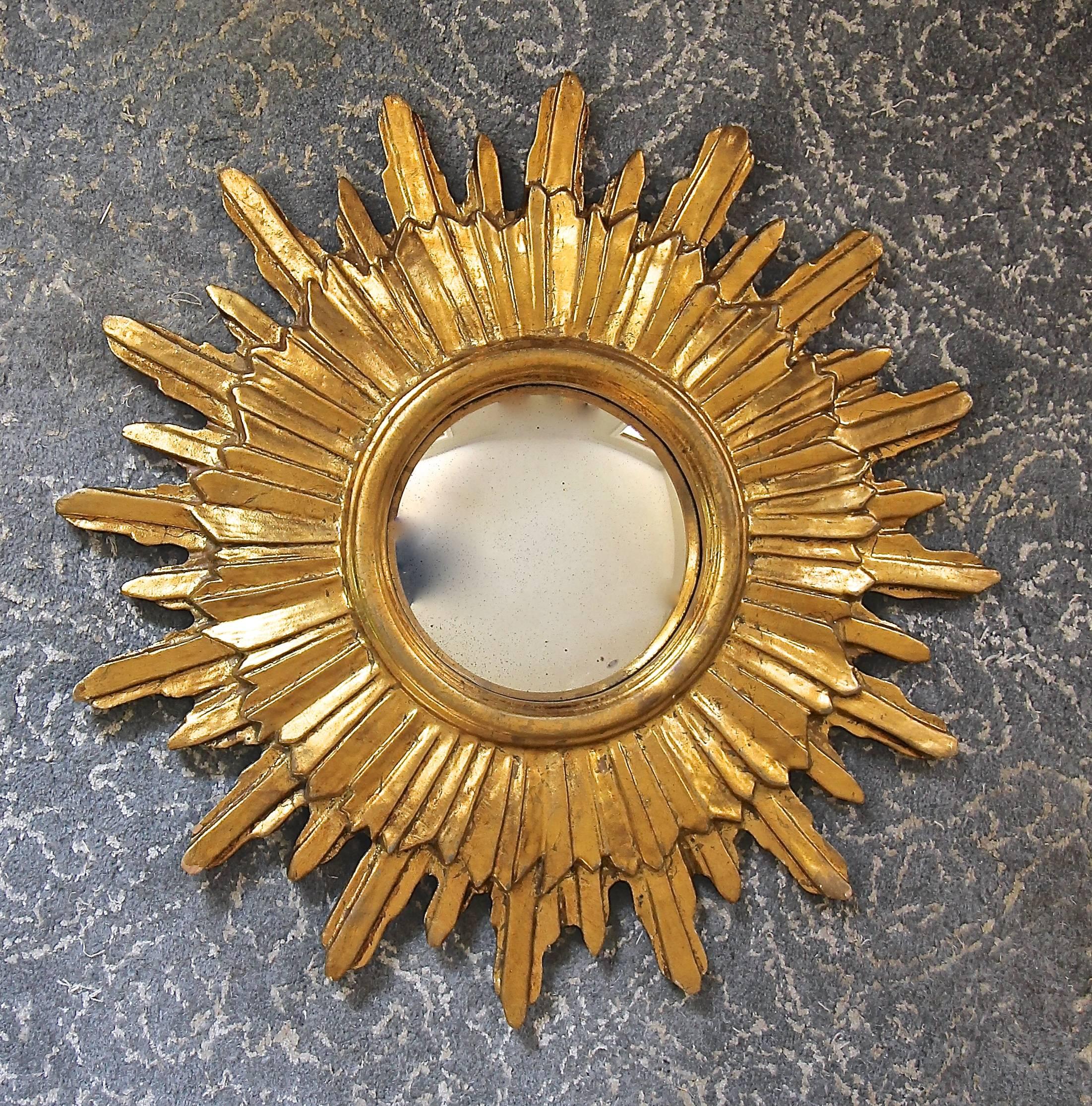 French style soleil giltwood wall mirror with convex inset mirror.