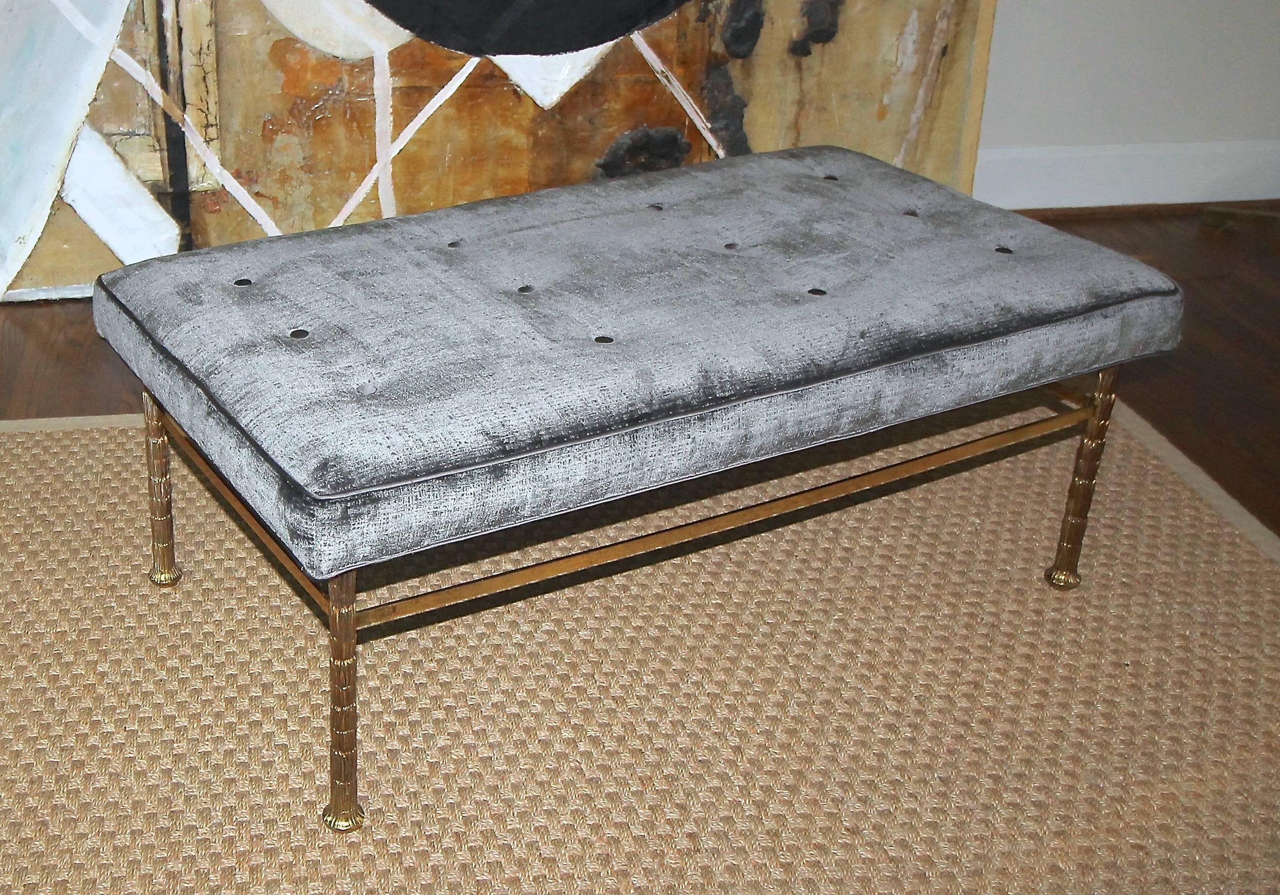 Superb quality Maison Jansen bronze upholstered bench. The legs have a beautifully detailed palm trunk motif. Newly upholstered in grey velvet fabric with matching satin trim and tufted buttons.