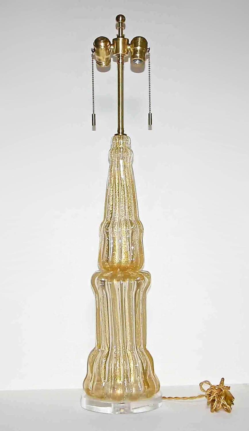 A very large two-piece Barovier & Toso Murano glass lamp with clear and gold inclusions and thick vertical ribs. Newly wired on custom acrylic base with brass hardware and French style twisted rayon covered cord.

Overall height 33
