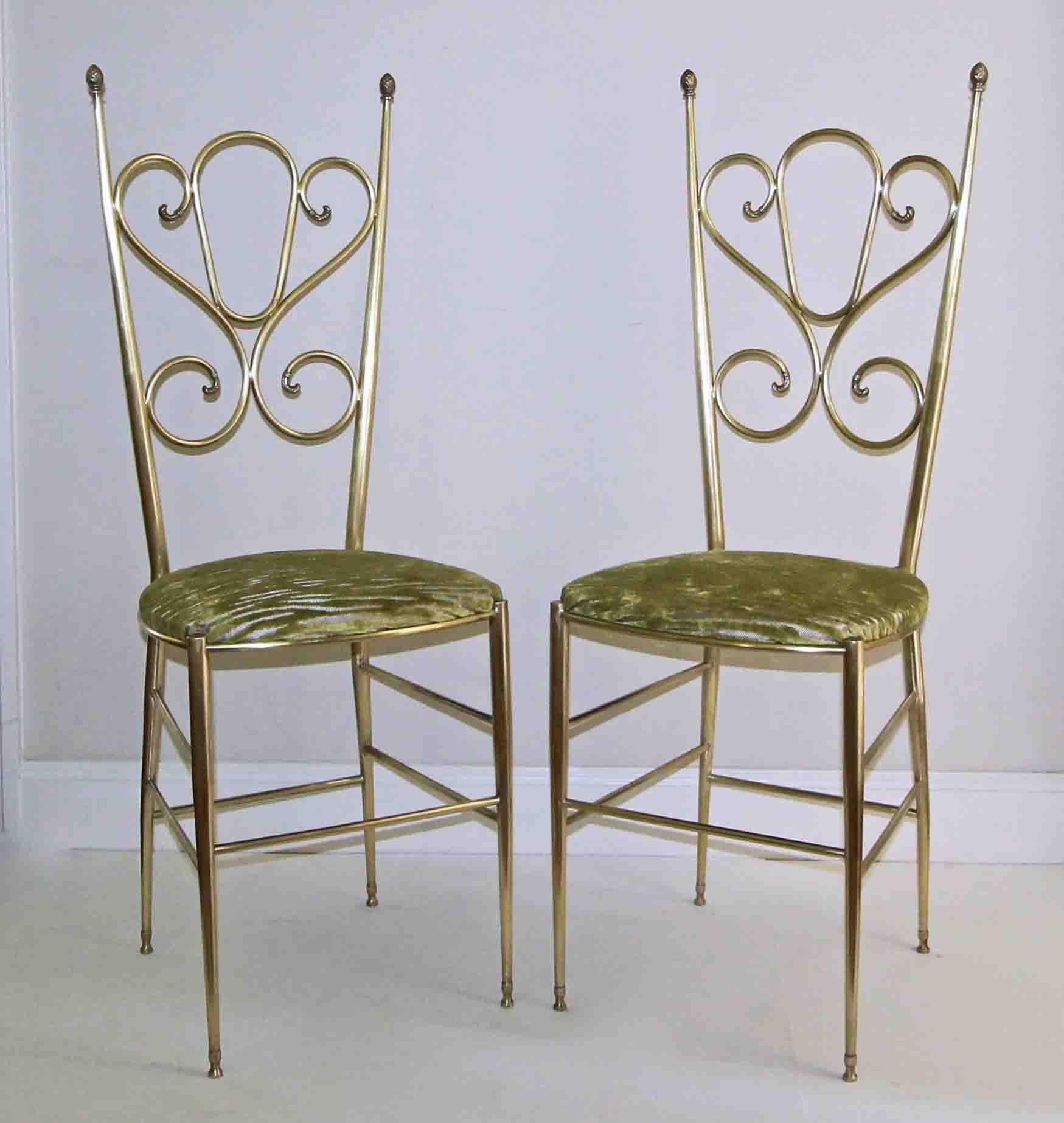 Pair of brass Italian tall back side chairs with scrolling back and pineapple finial details. Slip seats are covered in a new high end green cut velvet. Tubular brass construction. Attributed to Chiavari. 