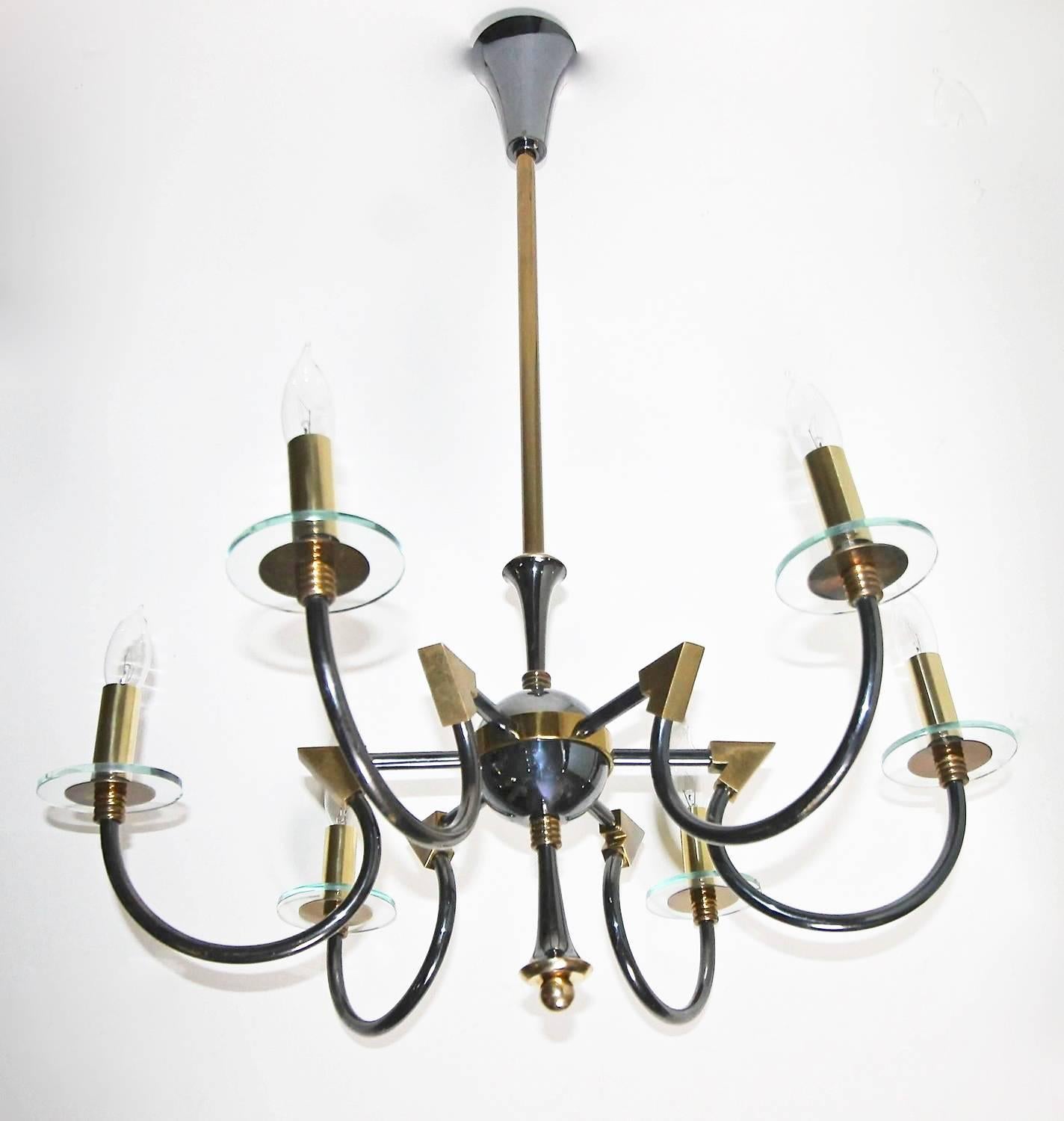 French moderne brass patinated six-arm chandelier by Maison Lunel, France. Sleek detailing including curved arms each with glass bobeche. Uses six 40 watt max candelabra "B" base bulbs. Newly wired. Overall height including center rod and
