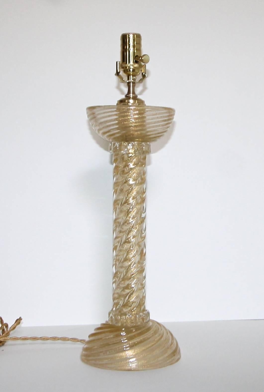 Exquisite Italian Murano clear glass lamp with gold inclusions in a twisted form by Barovier & Toso. Newly wired for US with brass hardware and French style twisted rayon covered cord. Shade not included and is shown for photography purposes